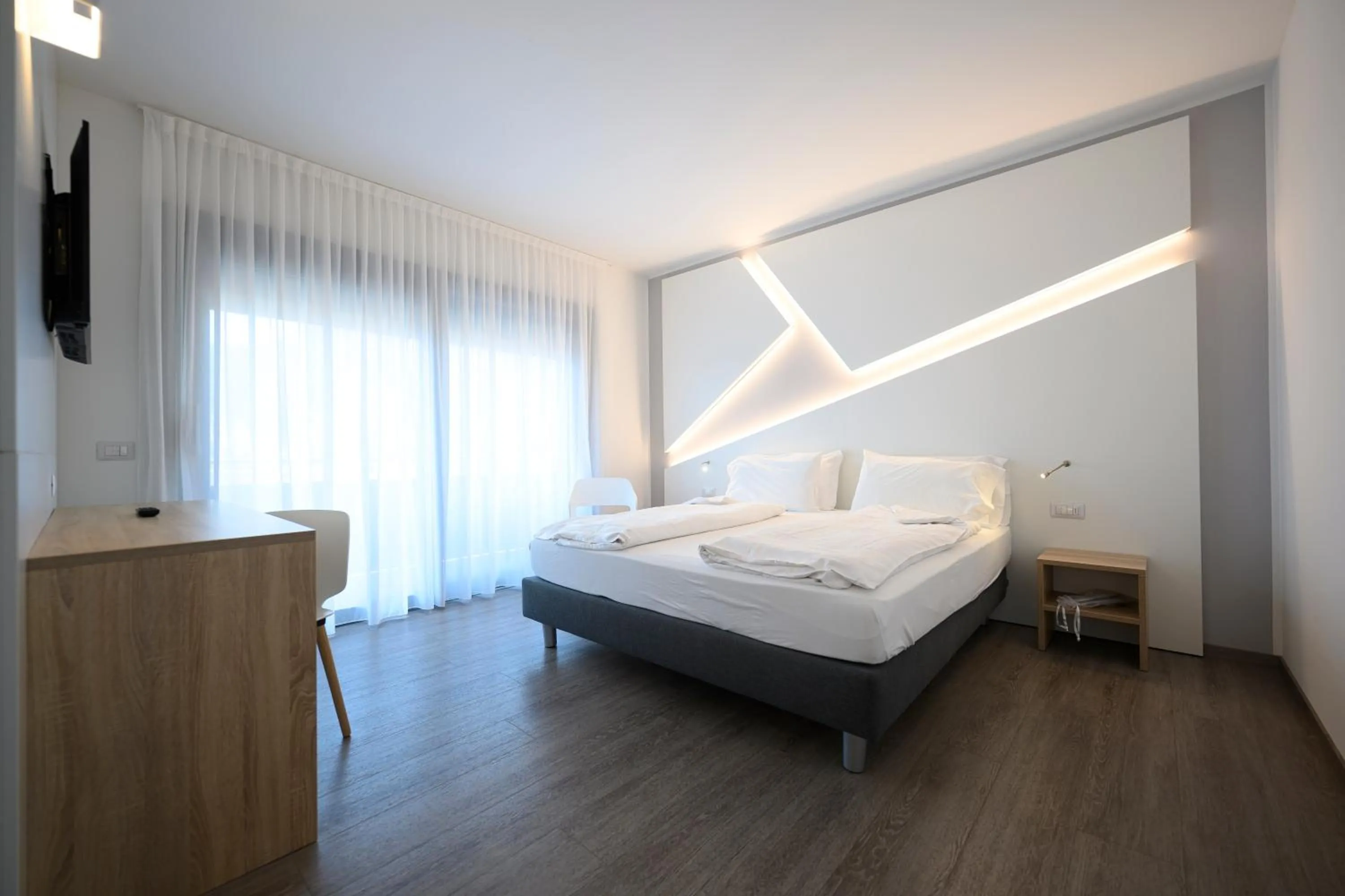 Bed in Hotel Riviera