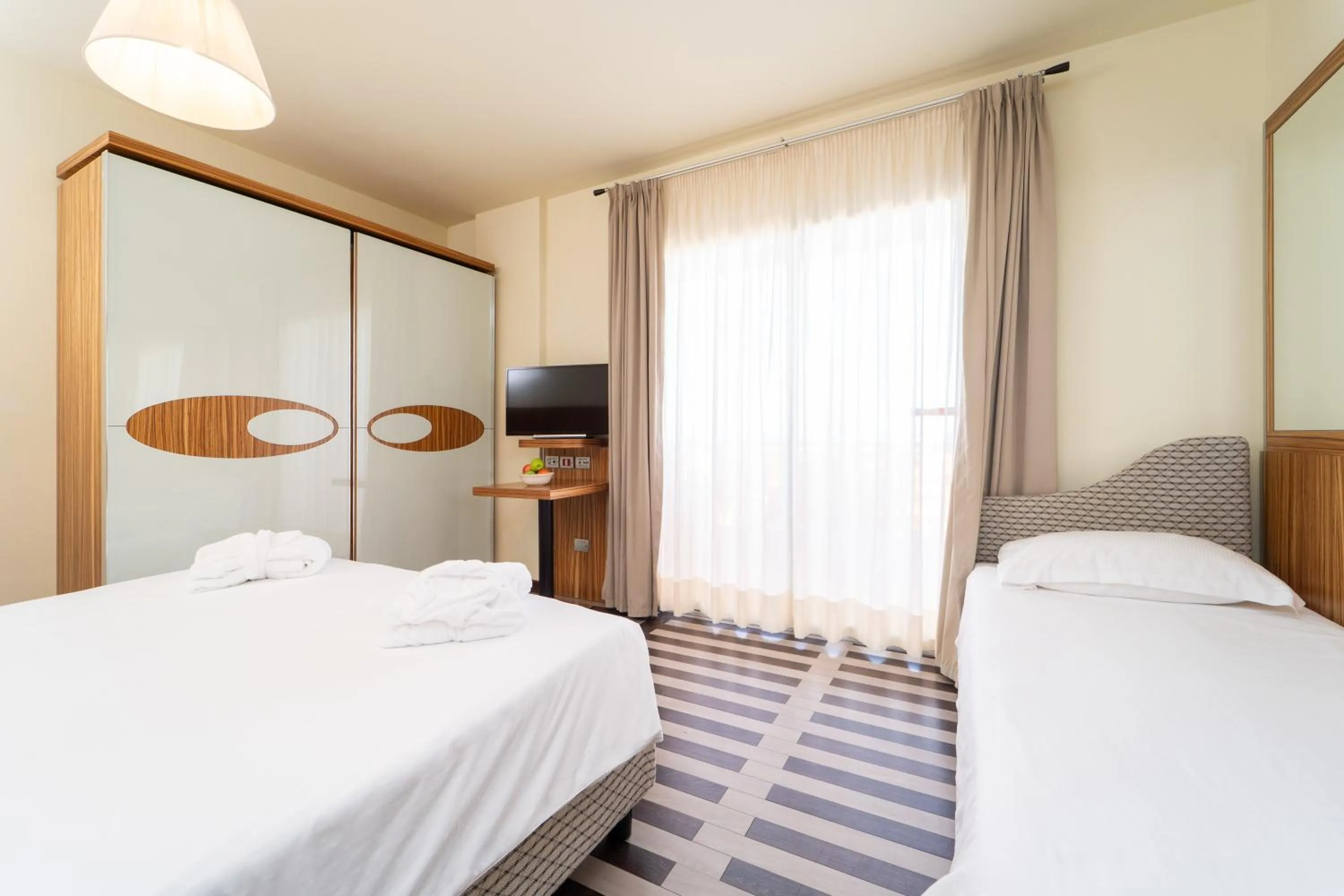 Bed in Bibione Palace Hotel