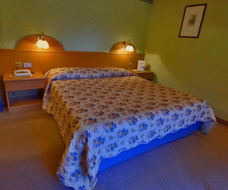 Bed in Monaco Sport Hotel