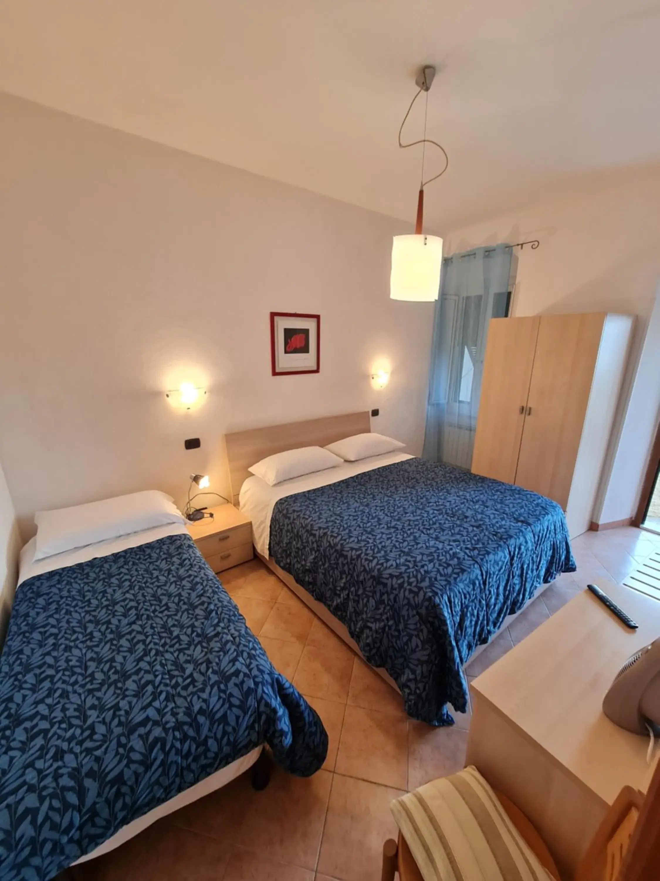 Triple Room in Albergo Genio Triple Room in Albergo Genio