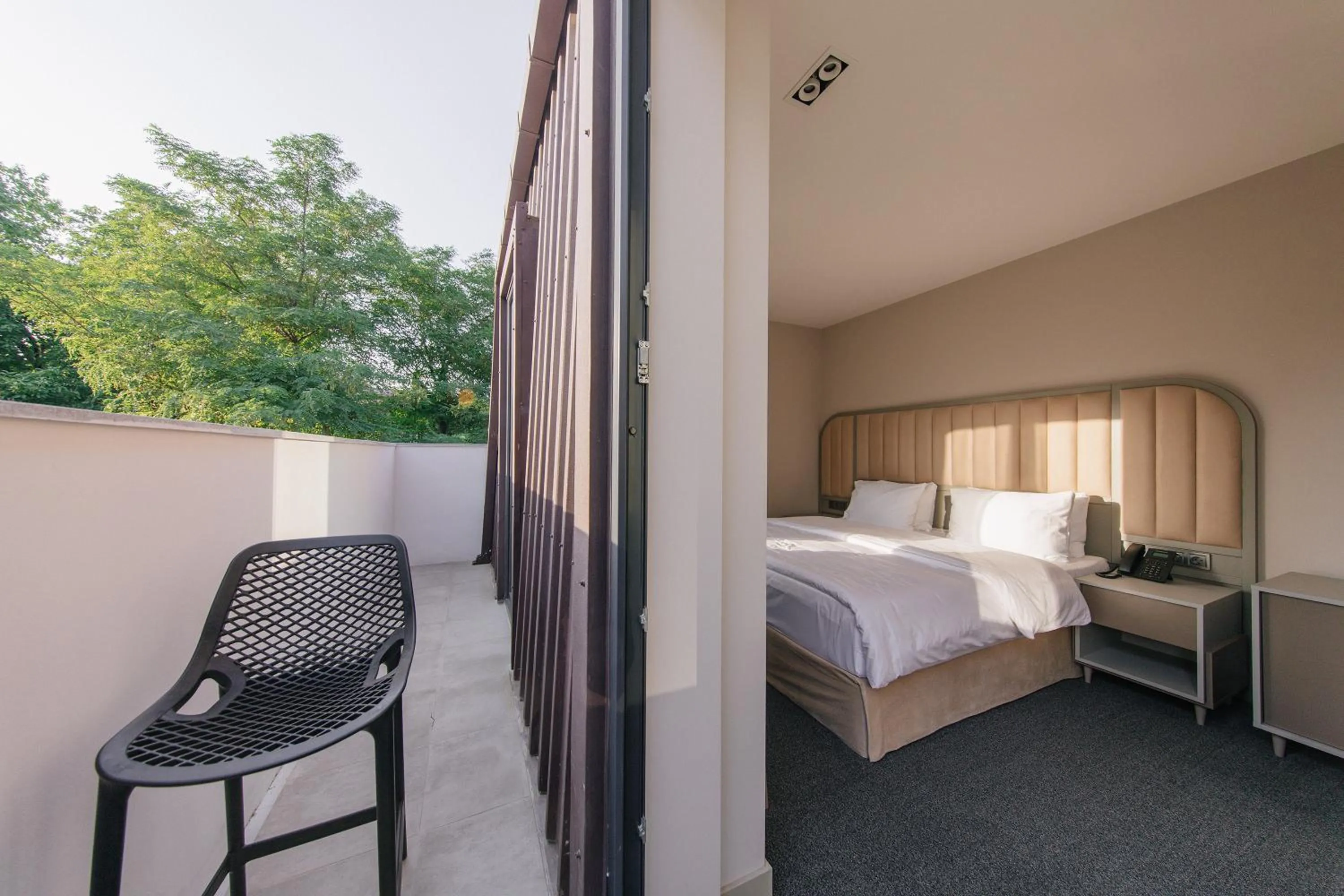 Bed in STROFI Boutique Hotel