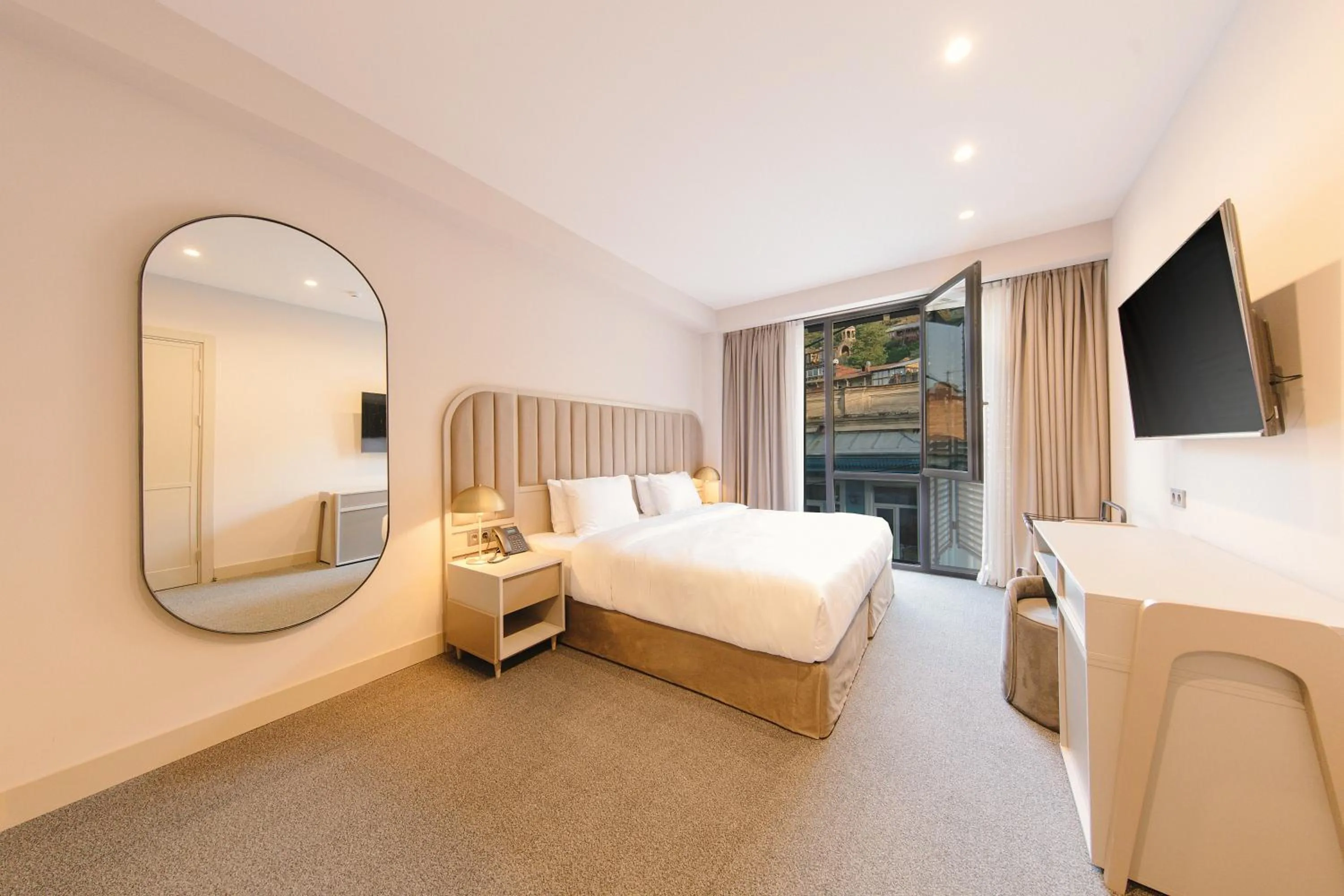 Bed in STROFI Boutique Hotel