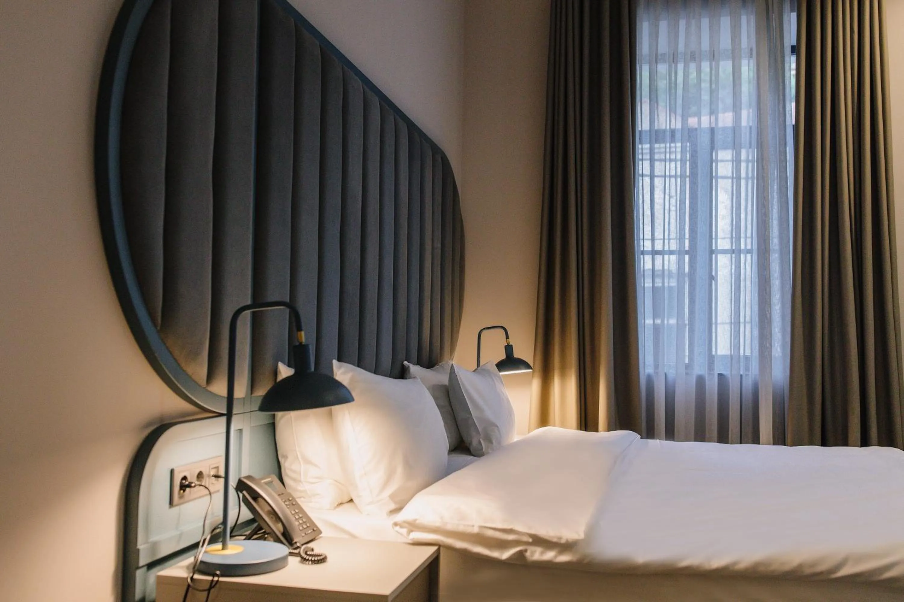 Bed in STROFI Boutique Hotel