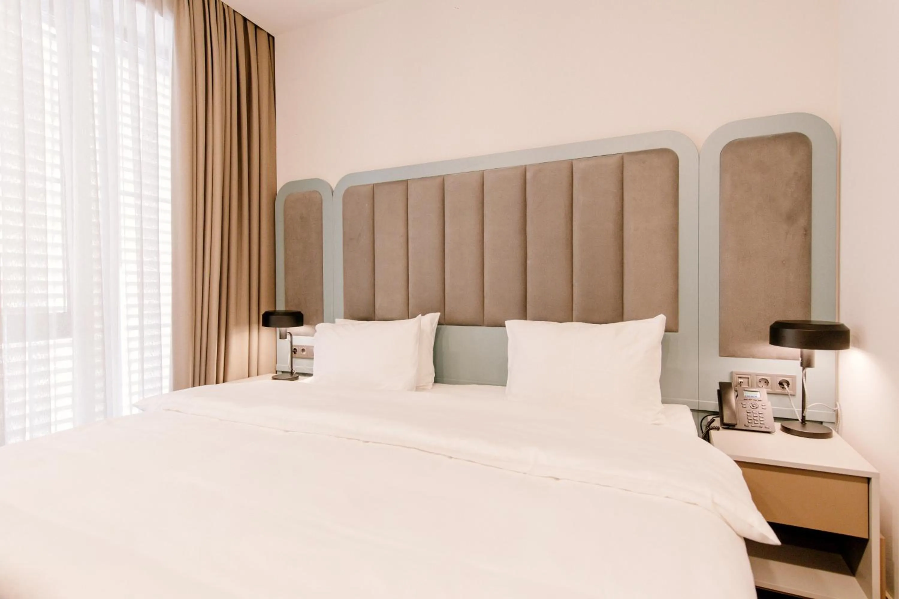 Bed in STROFI Boutique Hotel