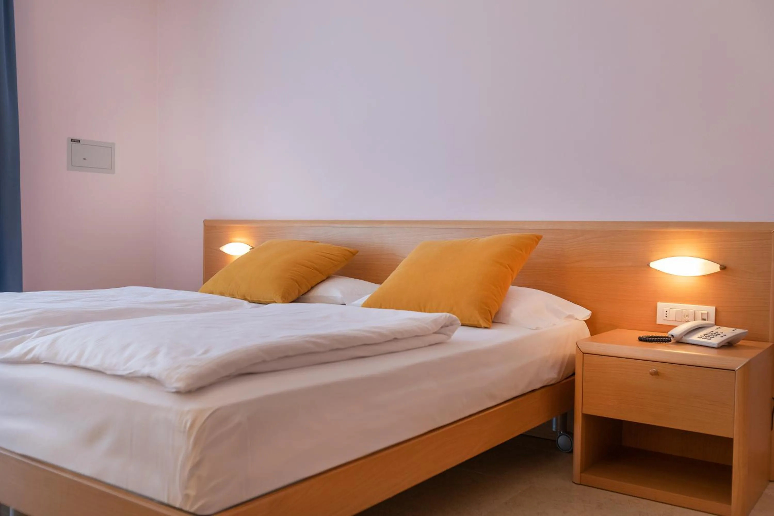 Bed in Hotel Garnì Orchidea