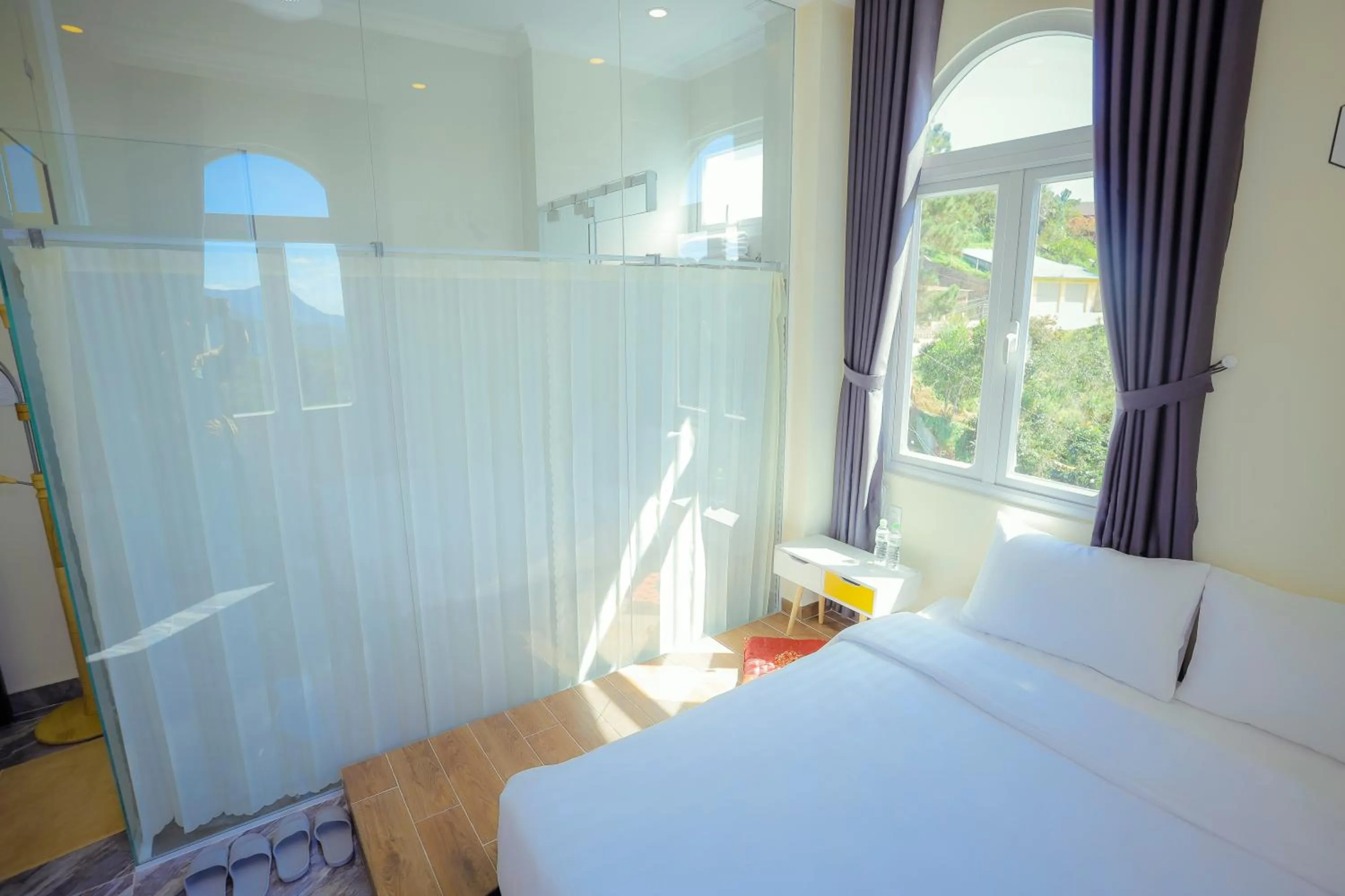 Bed in SHIN VILLAGE HOTEL