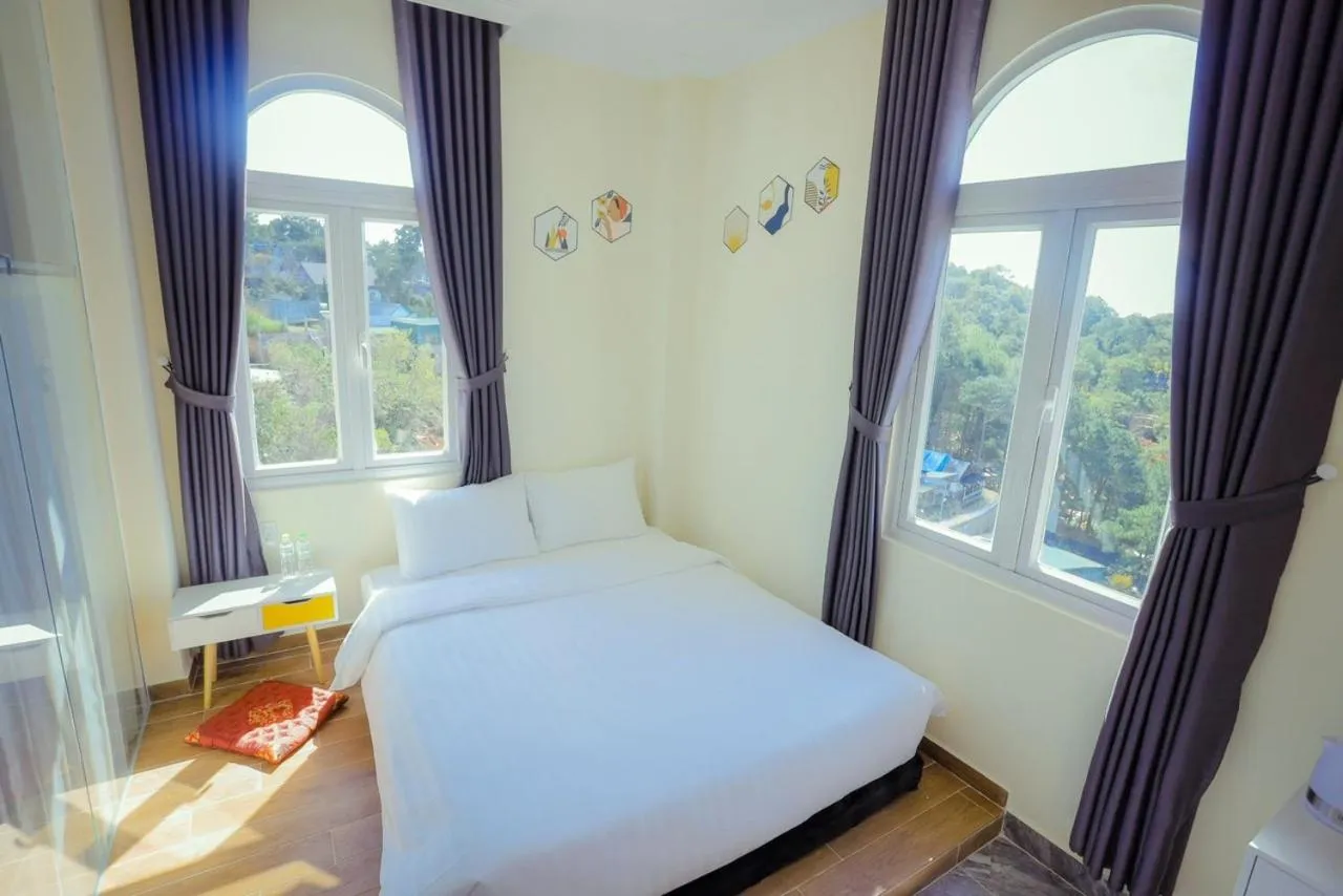 Bed in SHIN VILLAGE HOTEL