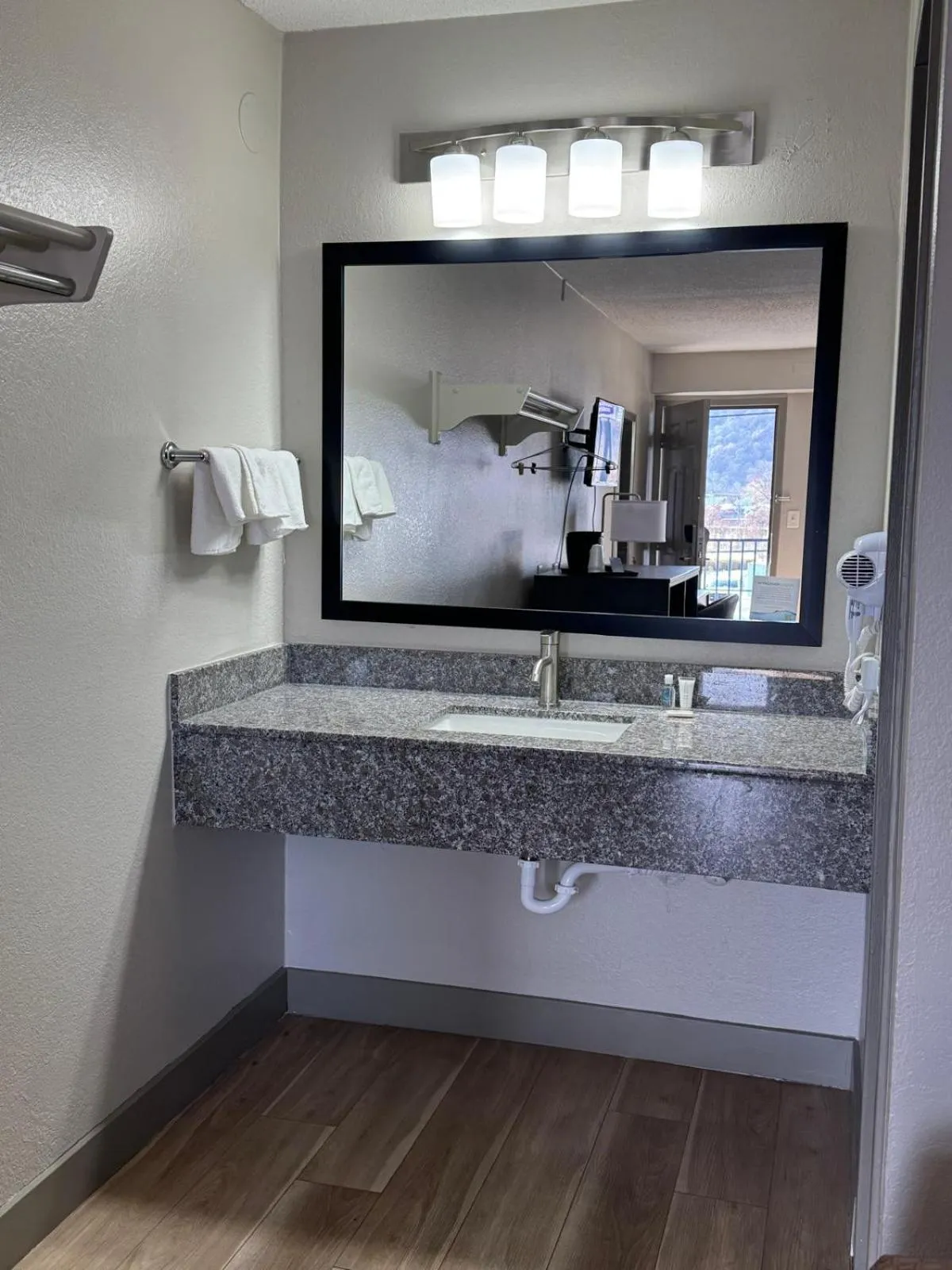 Bathroom in Super 8 by Wyndham Charleston WV