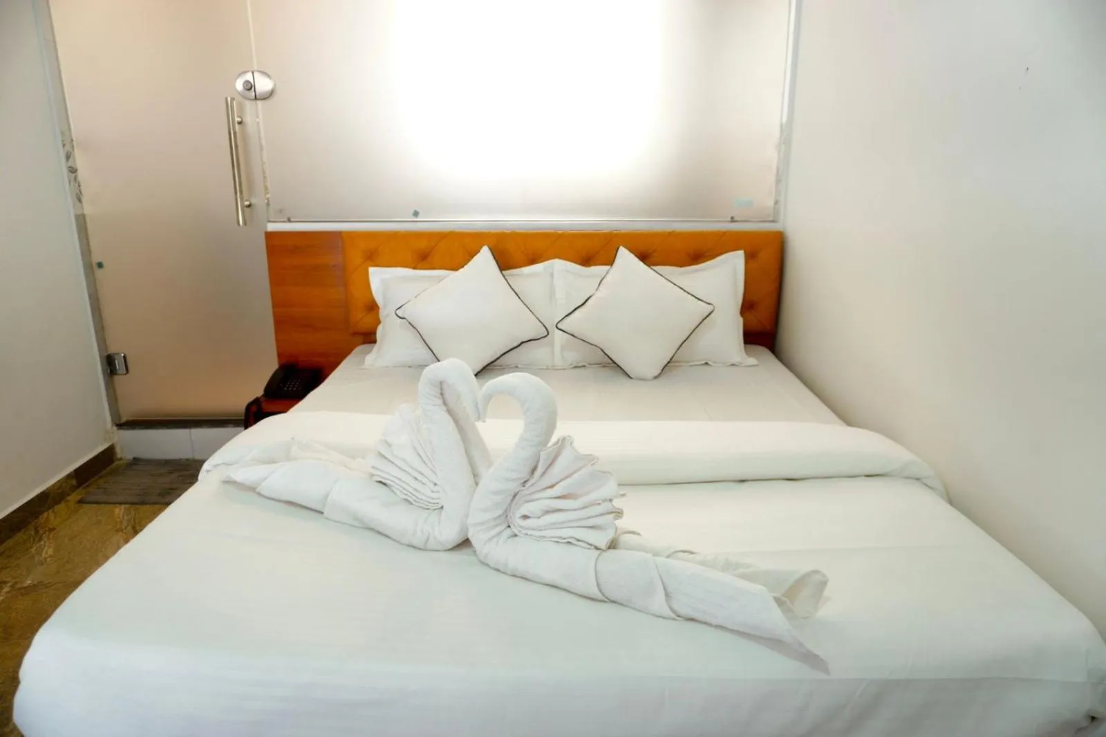 Bed in Hotel Santeria Inn, Best Luxurious Hotel AC Rooms In Surat