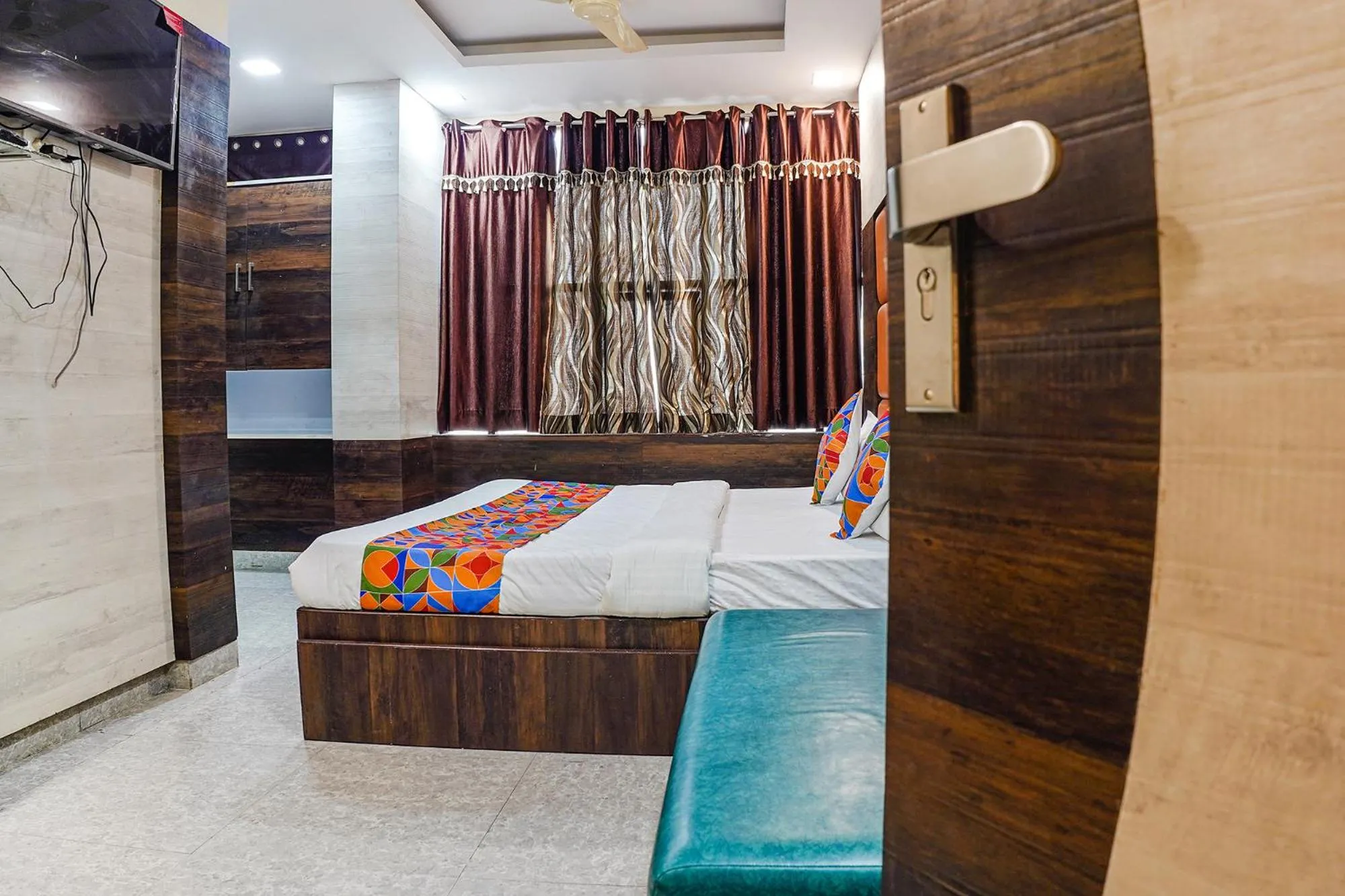 Bed in FabHotel Brij Residency