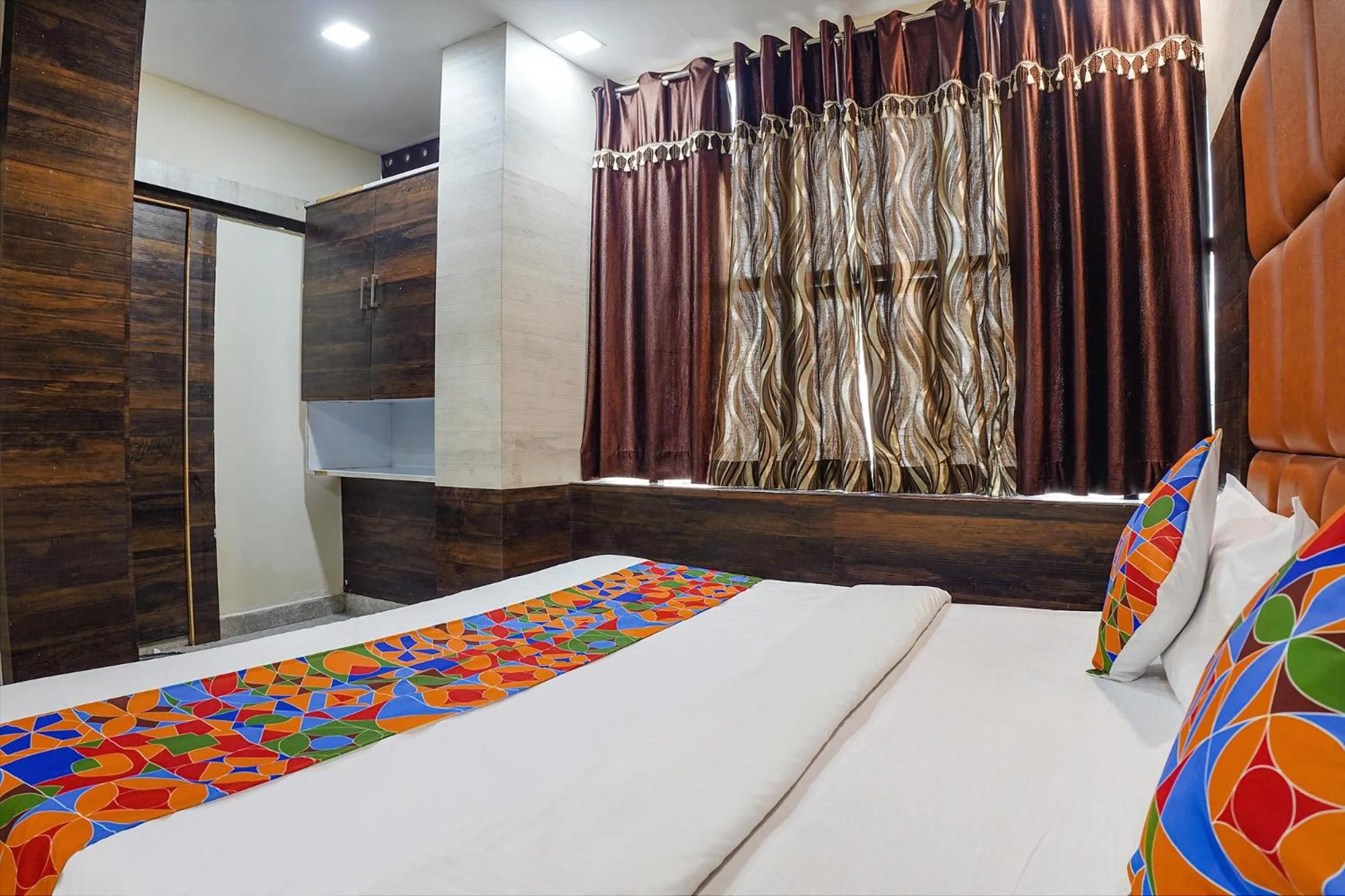 Bed in FabHotel Brij Residency