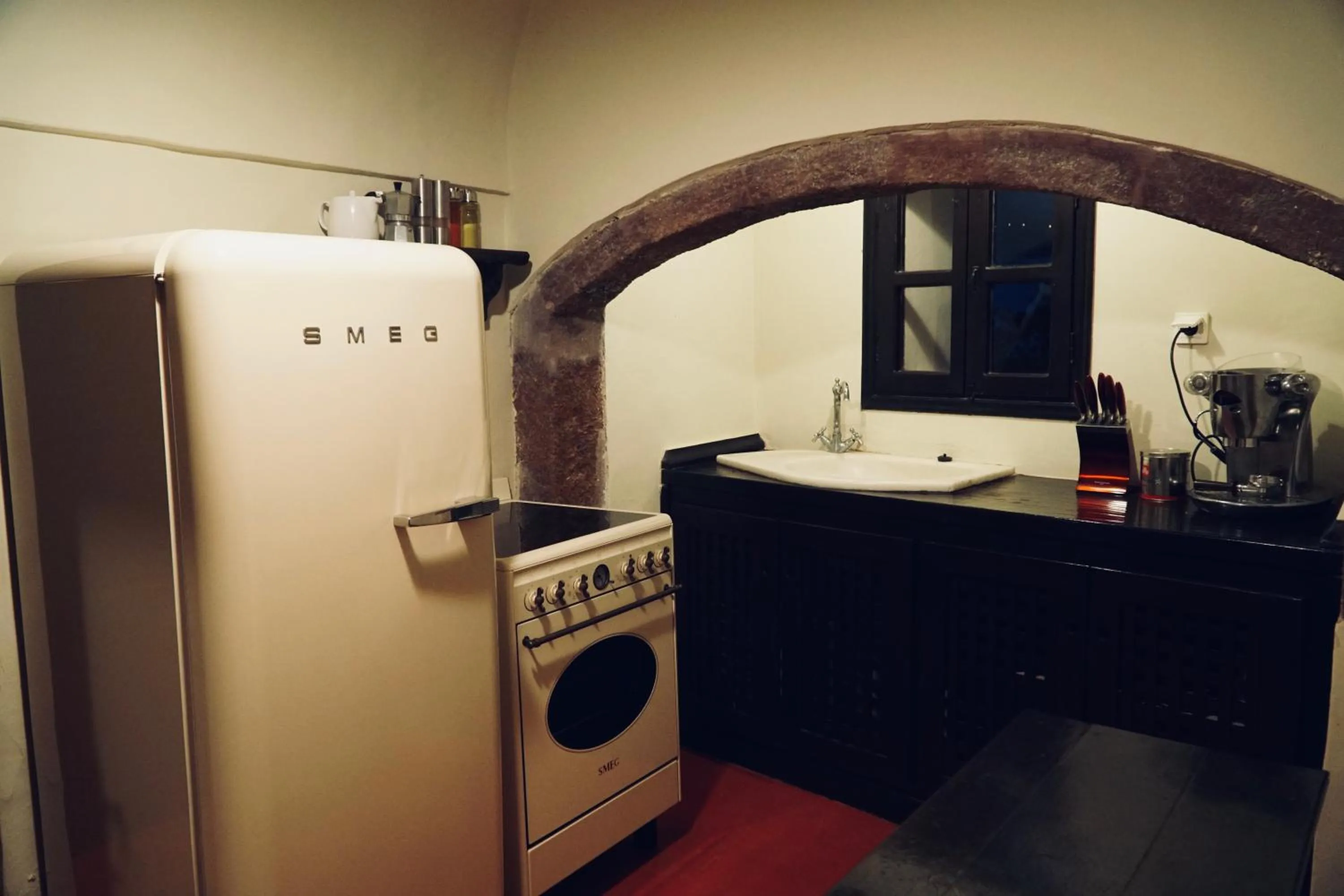 Kitchen or kitchenette in Santorini Heritage Villas