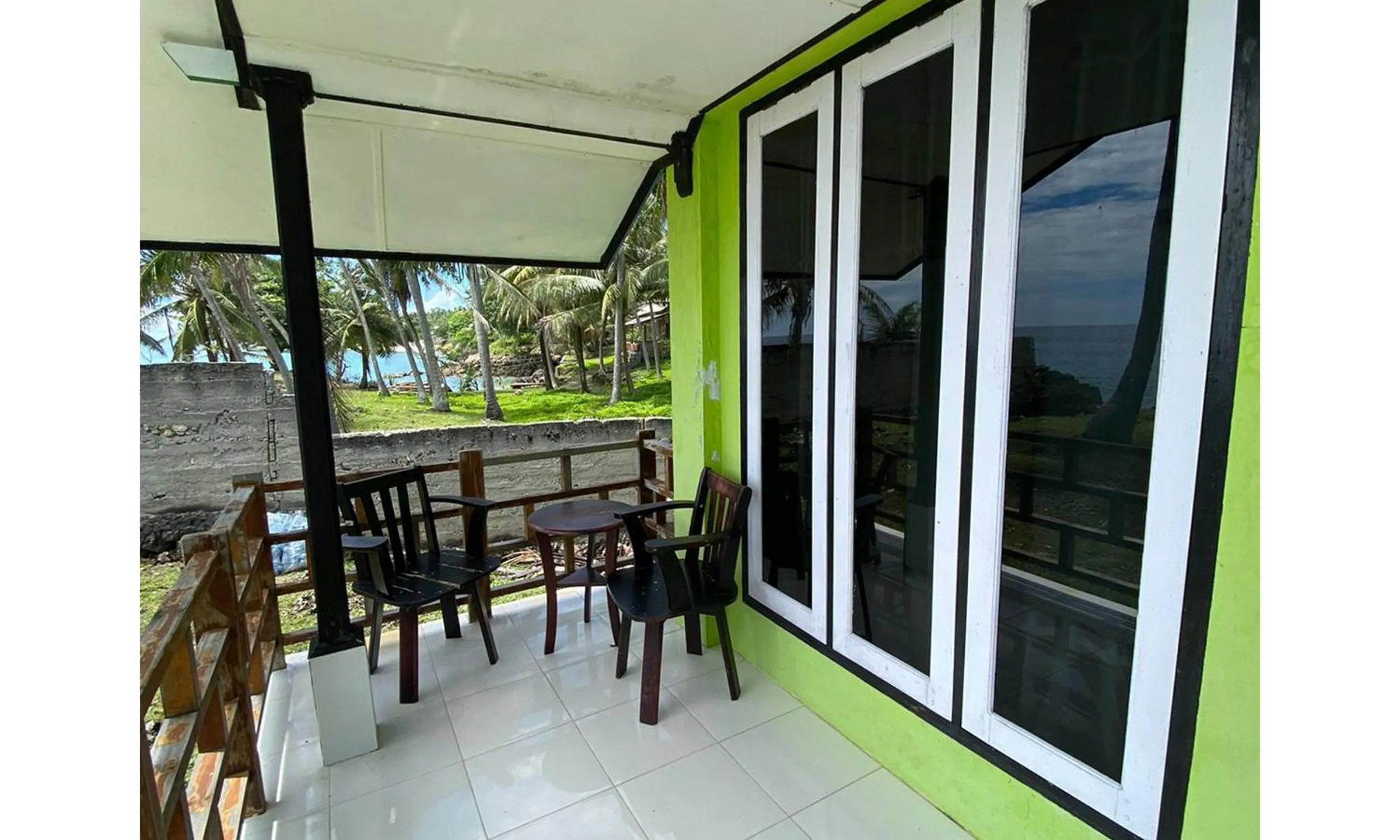 Seating area in RedDoorz Syariah near Ujong Kareung Beach Sabang