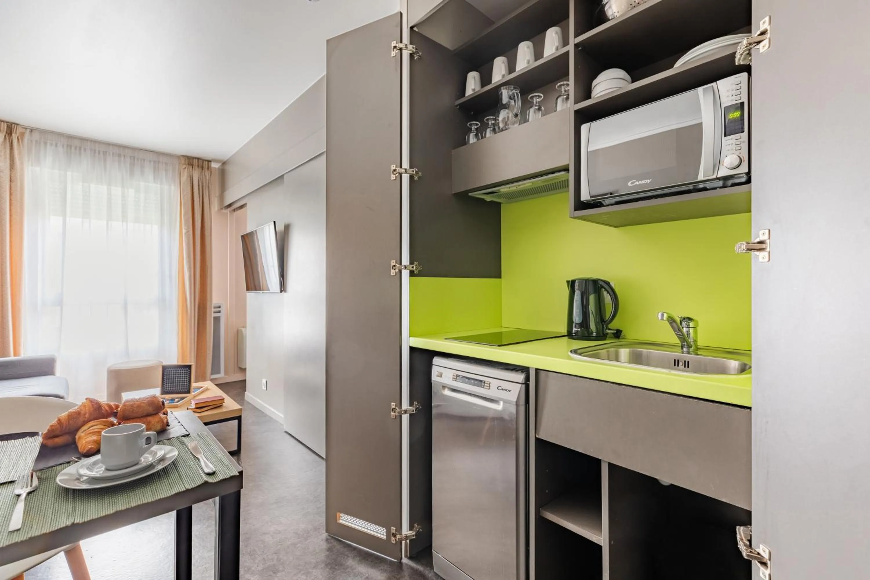 Kitchen or kitchenette in Appart’City Confort Le Bourget - Aéroport
