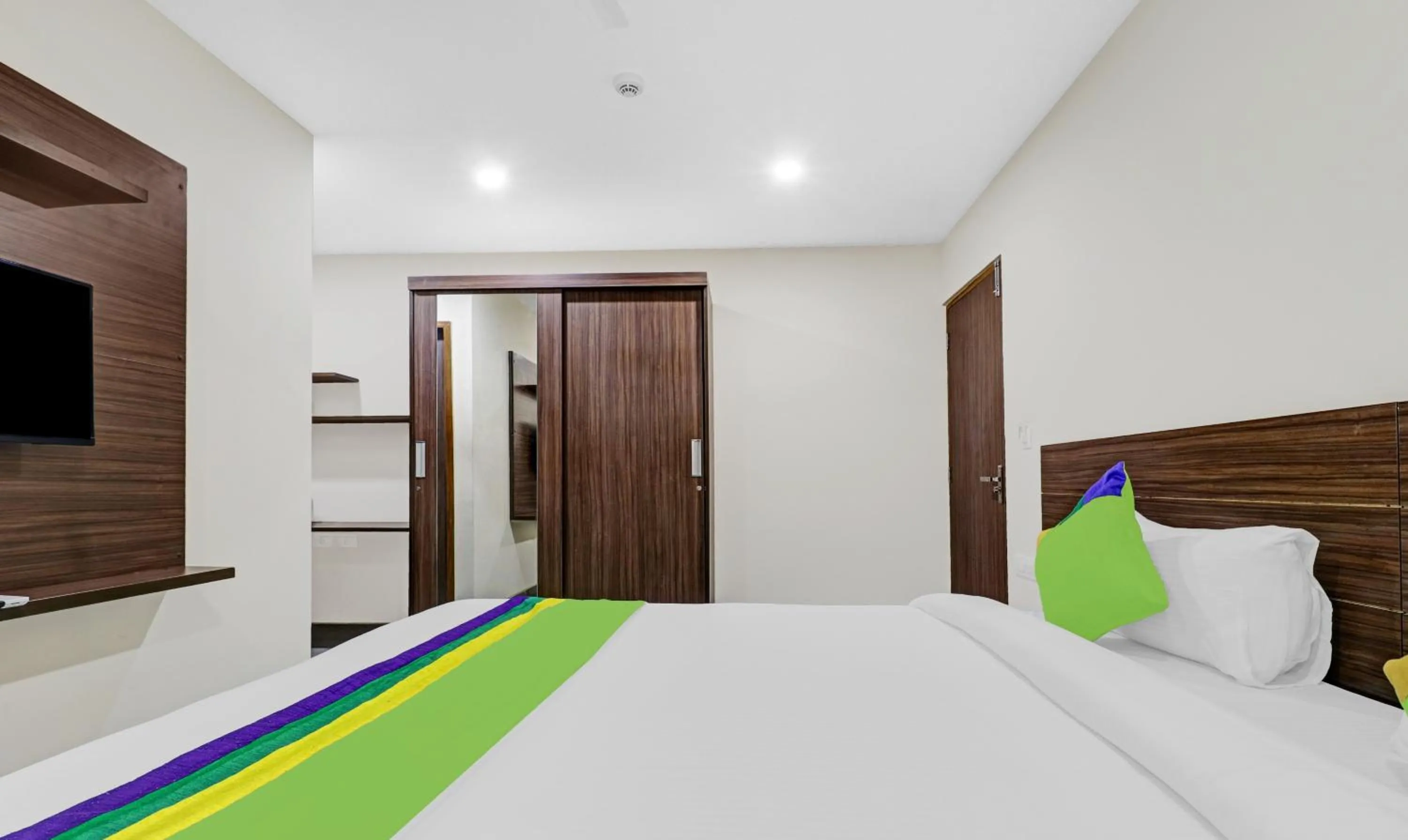 Bedroom, Bed in Treebo Purple Orchid Boutique