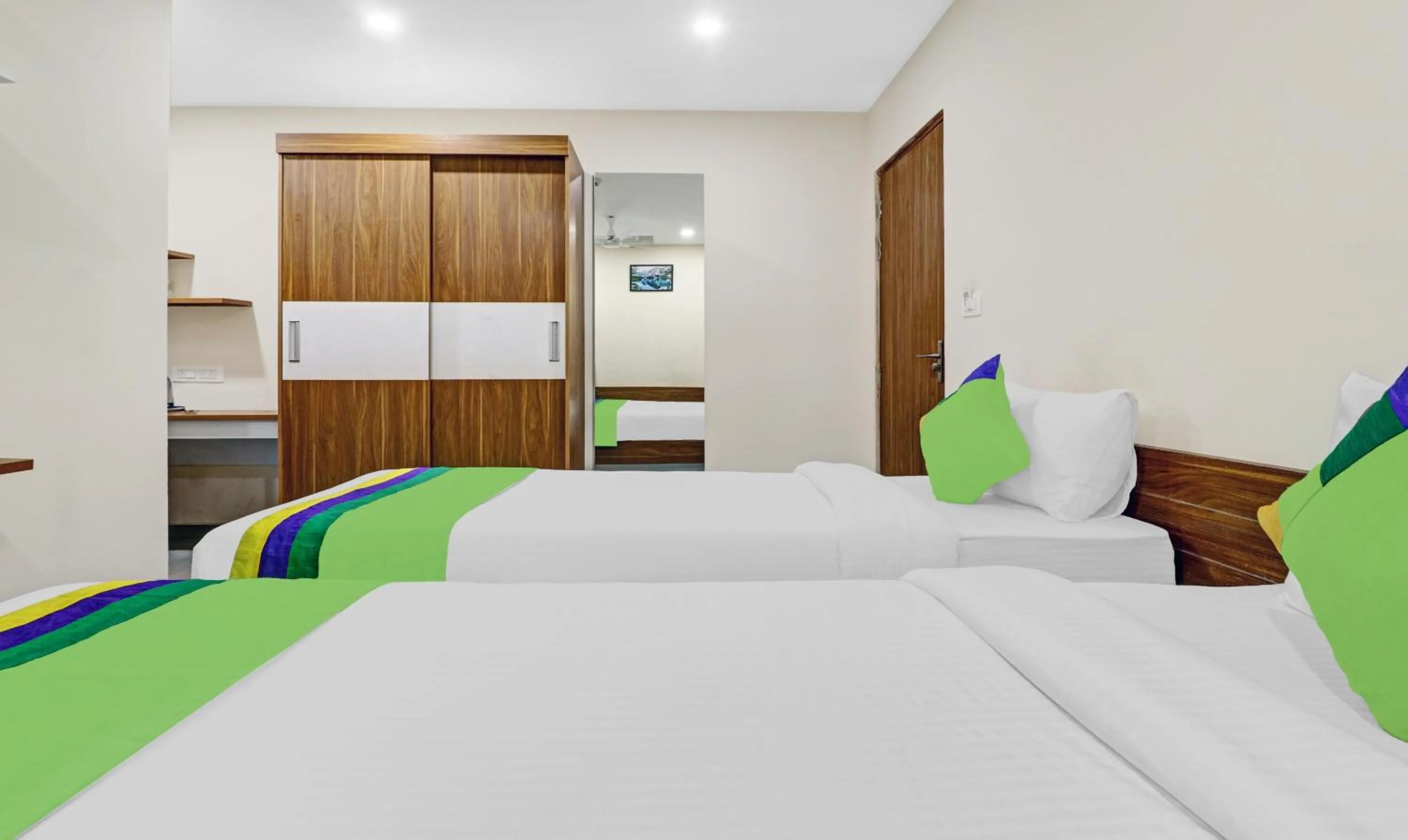 Bedroom, Bed in Treebo Purple Orchid Boutique