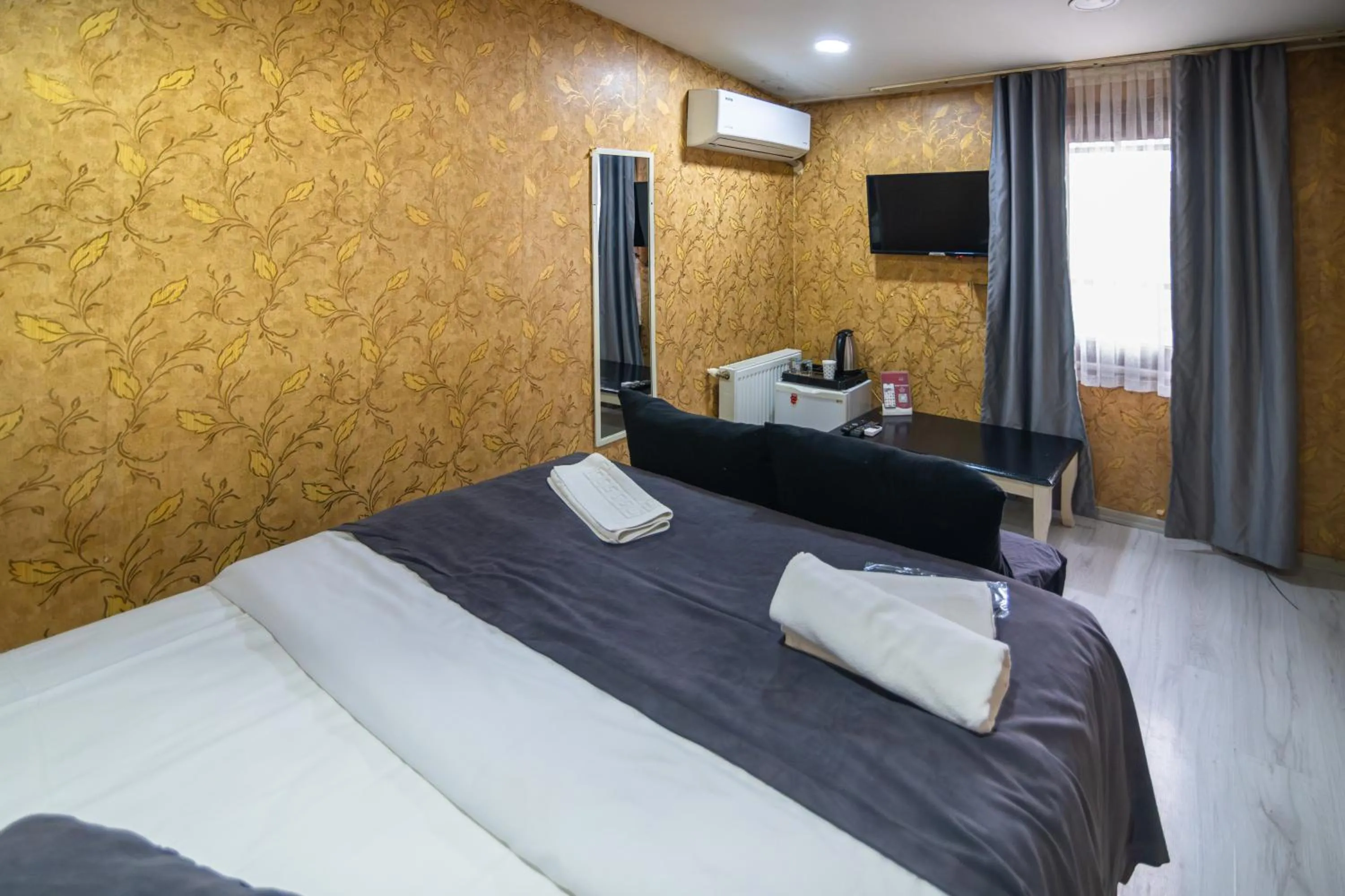 Bed in İmza Hotel Suite