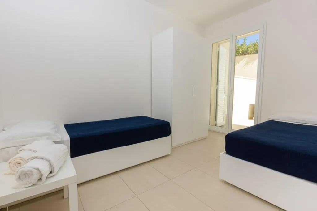 Bedroom, Bed in Appartamenti Sud Est