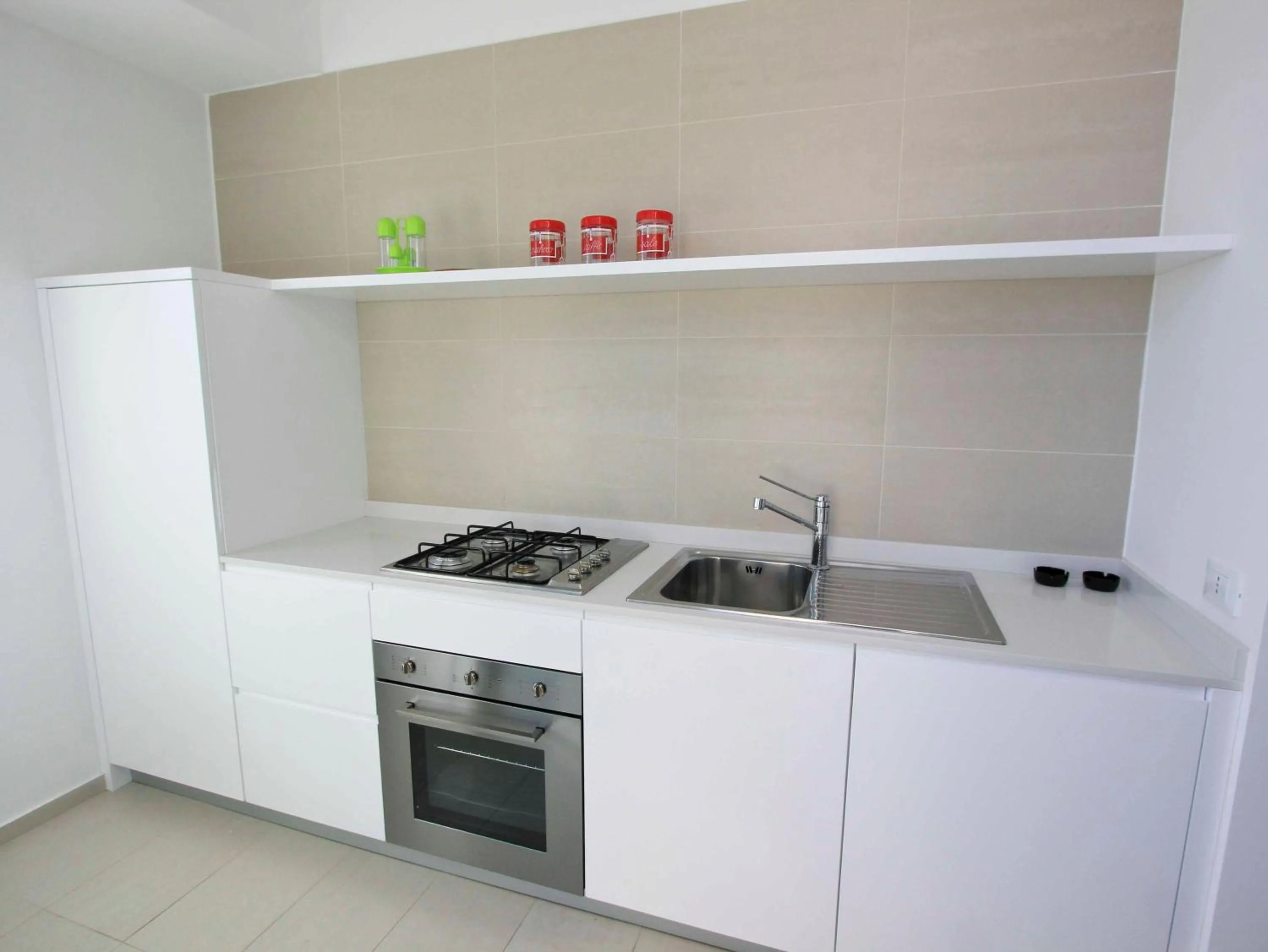 Kitchen or kitchenette in Appartamenti Sud Est