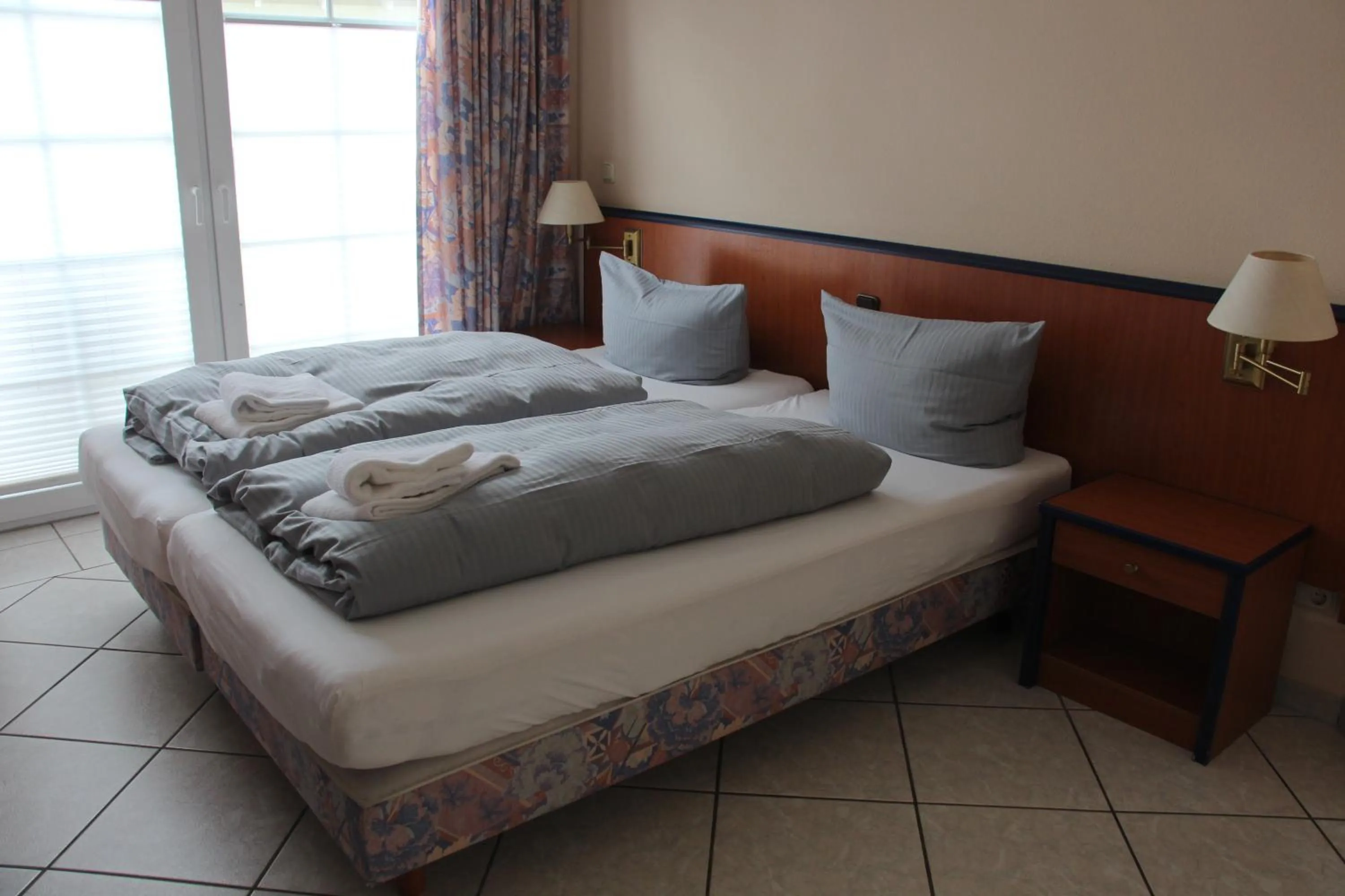 Bed in REGIOHOTEL Aparthotel Wernigerode