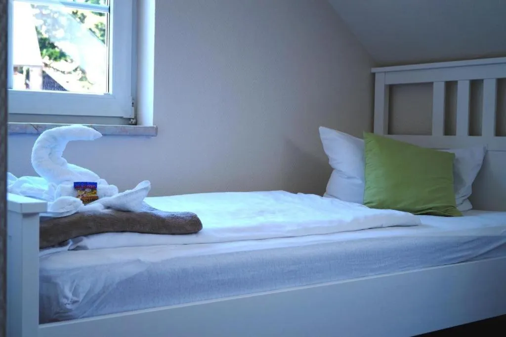 Bed in REGIOHOTEL Aparthotel Wernigerode