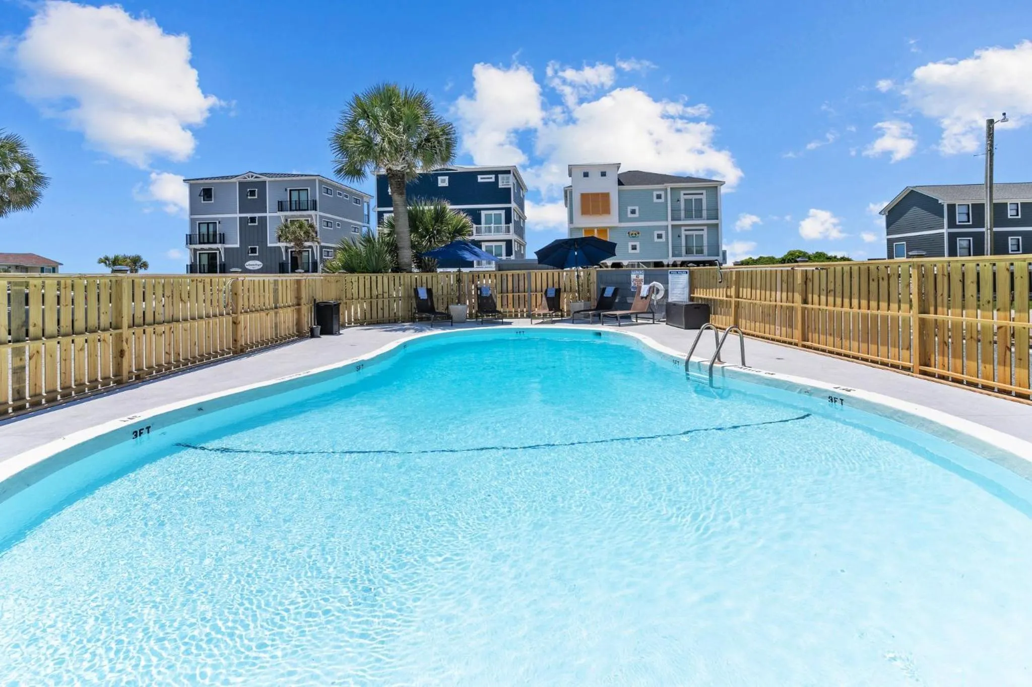 Swimming pool in The Beach House at Oak Island by Carolina Resorts