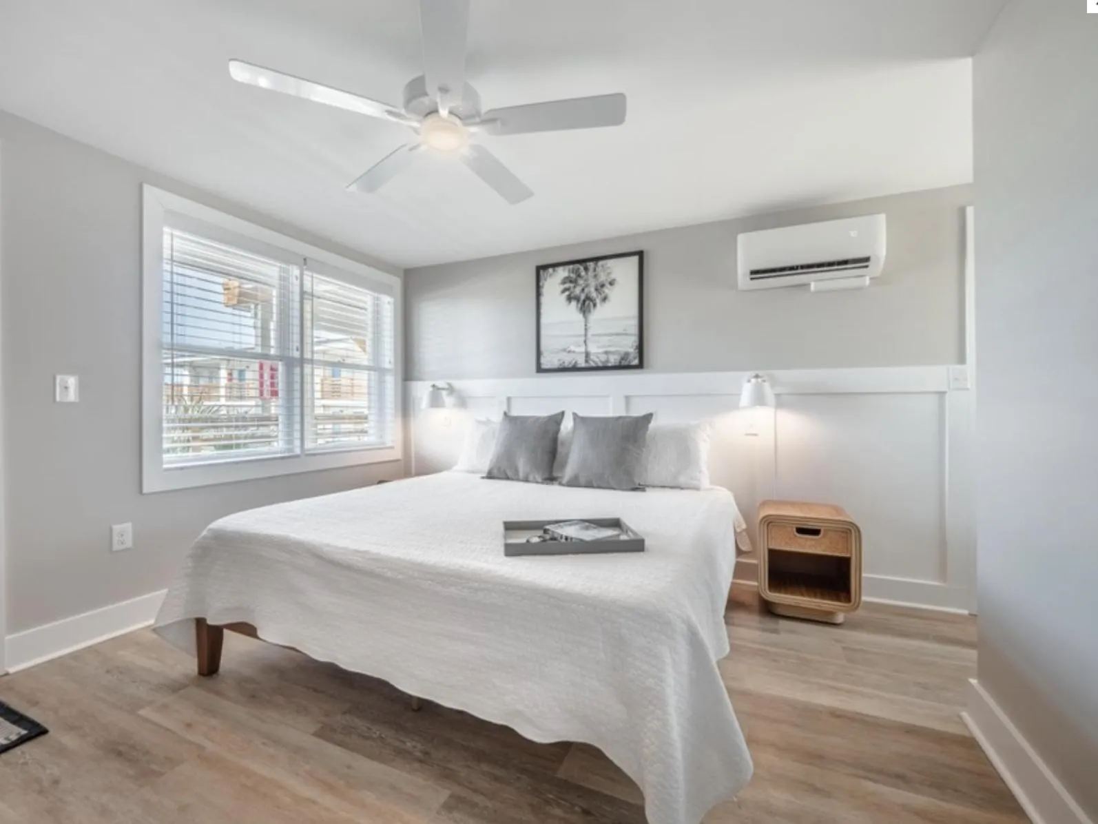 Bed in The Beach House at Oak Island by Carolina Resorts