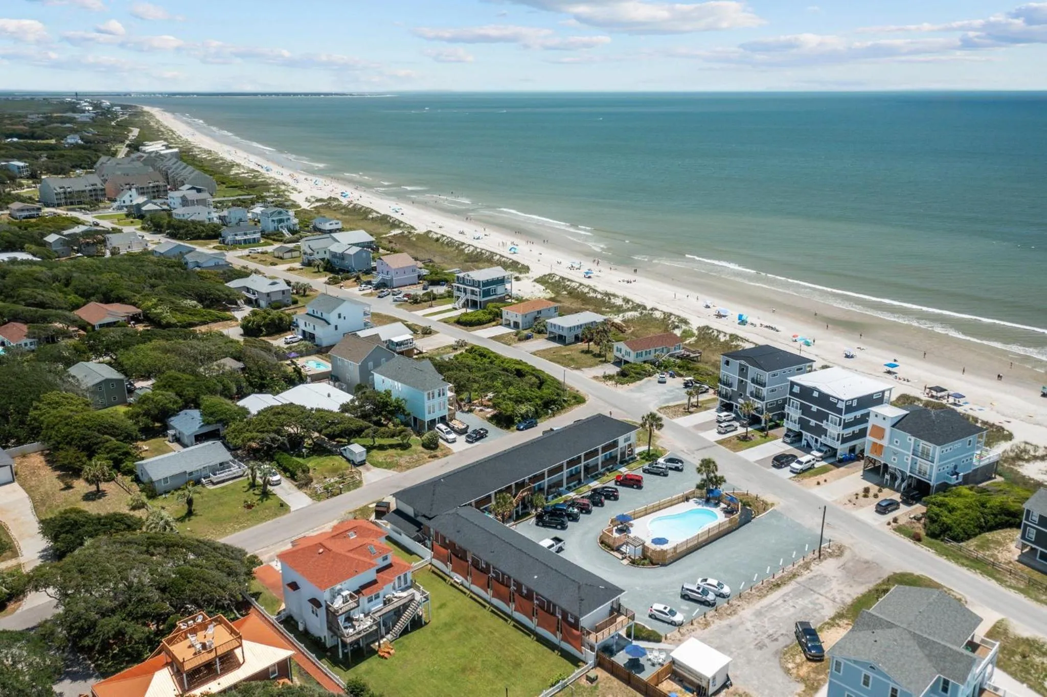 Property building in The Beach House at Oak Island by Carolina Resorts