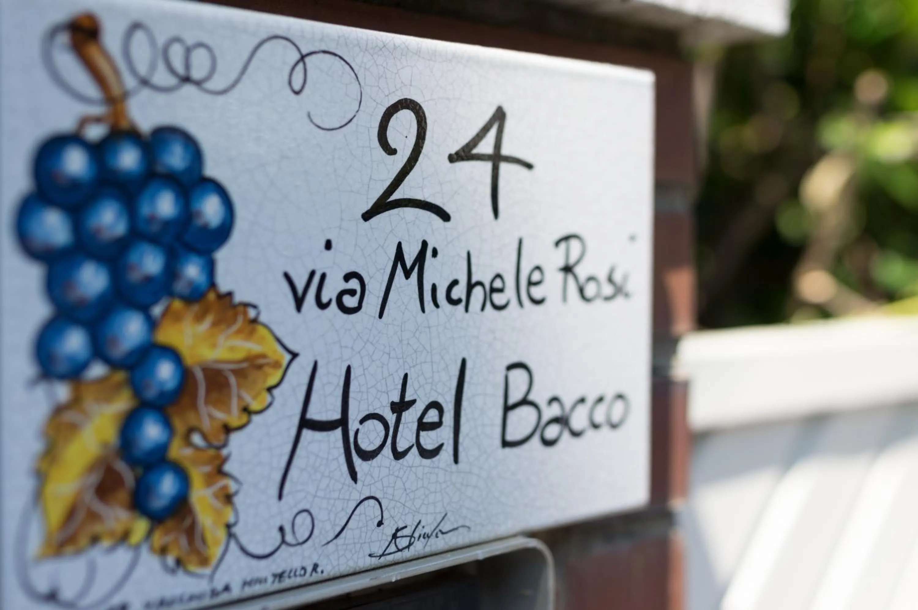 Property logo or sign in Hotel Bacco