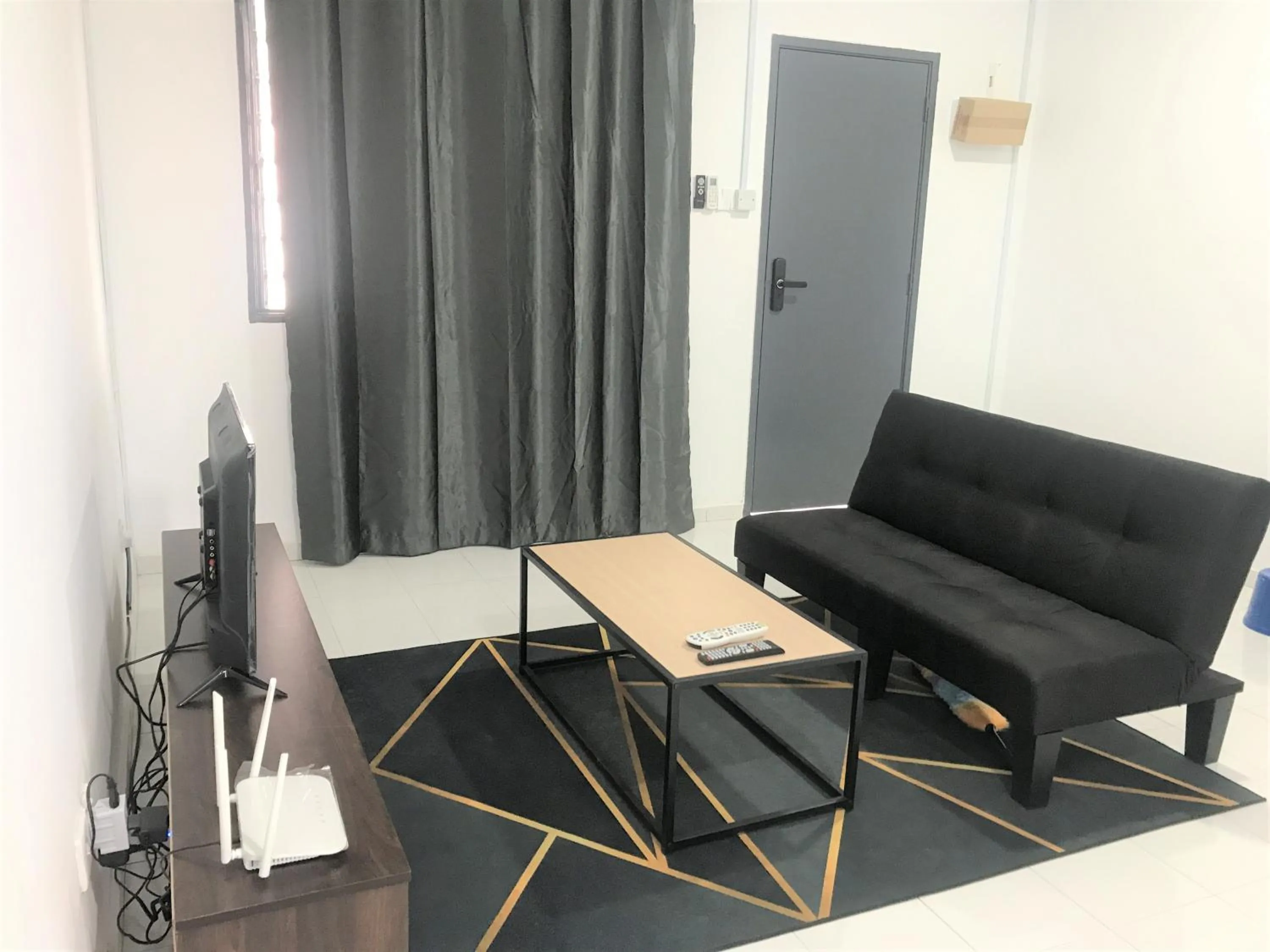 Living room in OYO 90493 JL Homestay