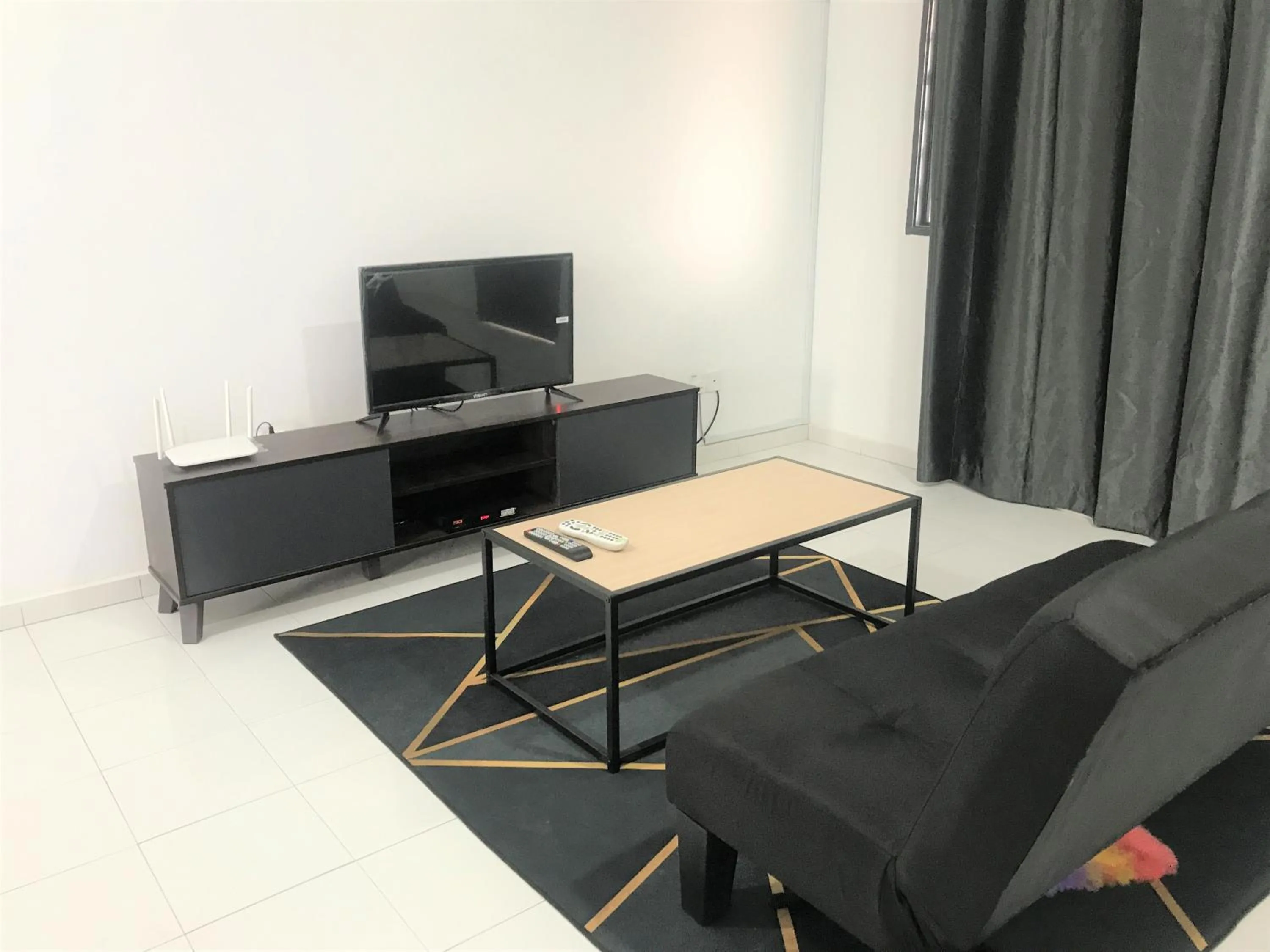 Living room in OYO 90493 JL Homestay