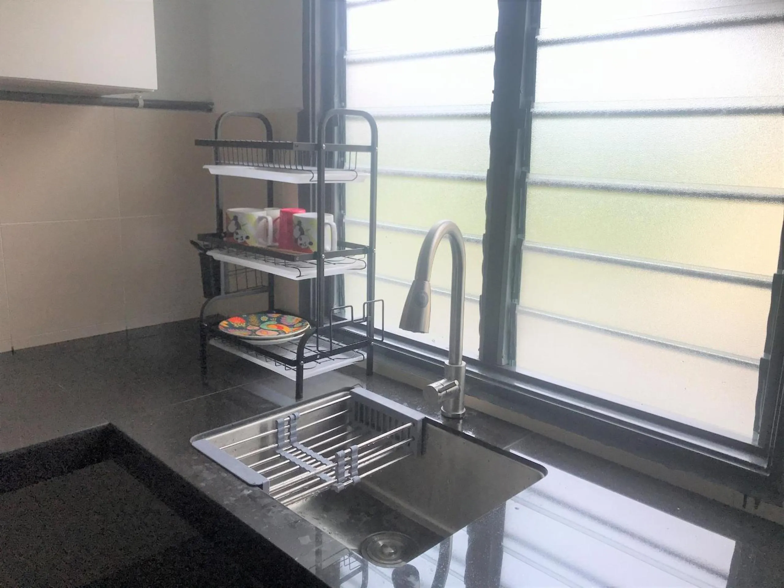 Kitchen or kitchenette in OYO 90493 JL Homestay