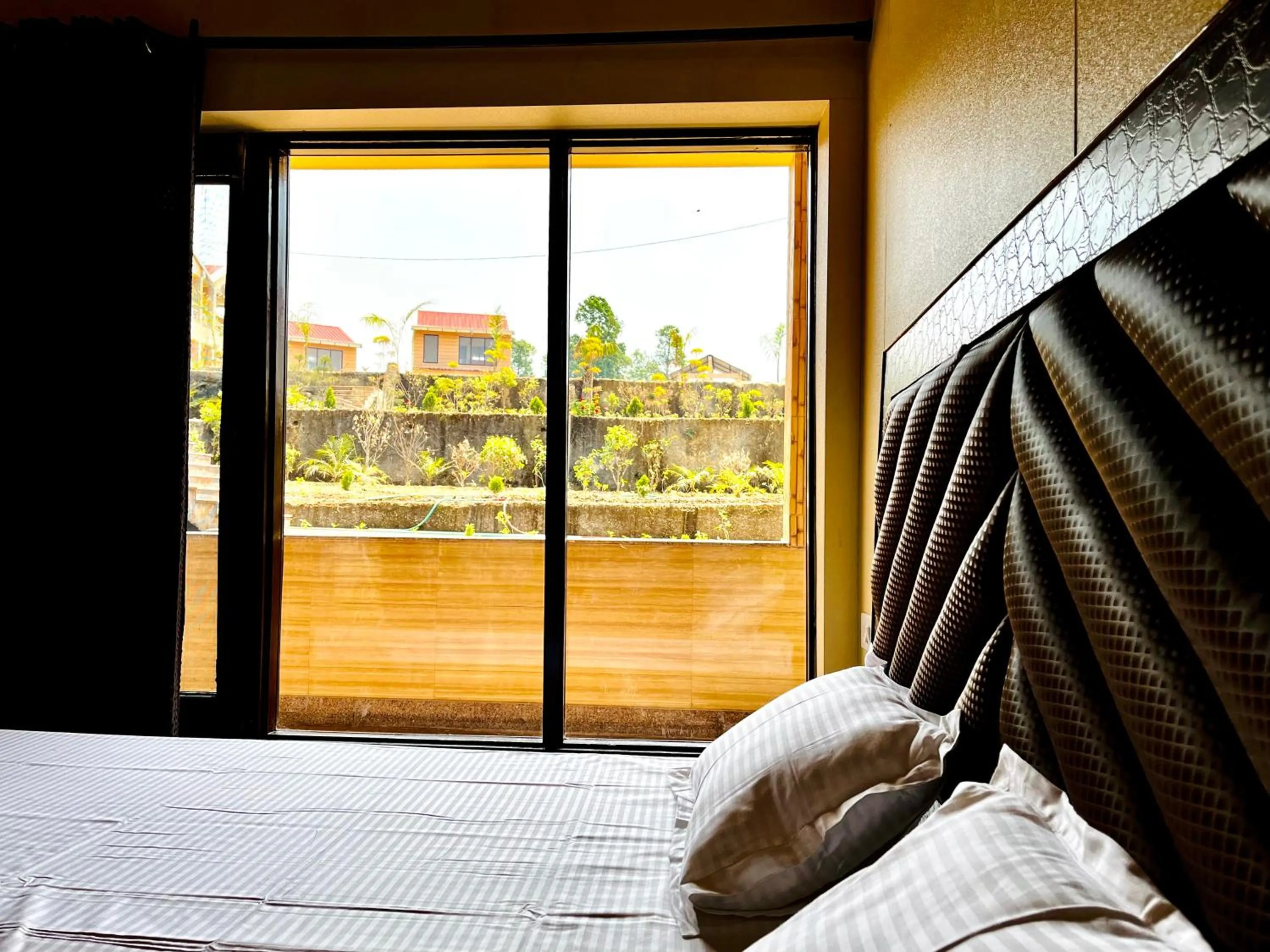 Garden view, Bed in NEELGAGAN RESORT