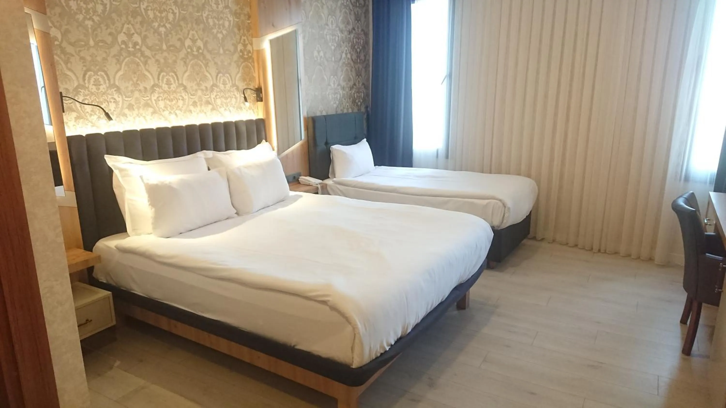 Bed in Isnova Hotel Airport