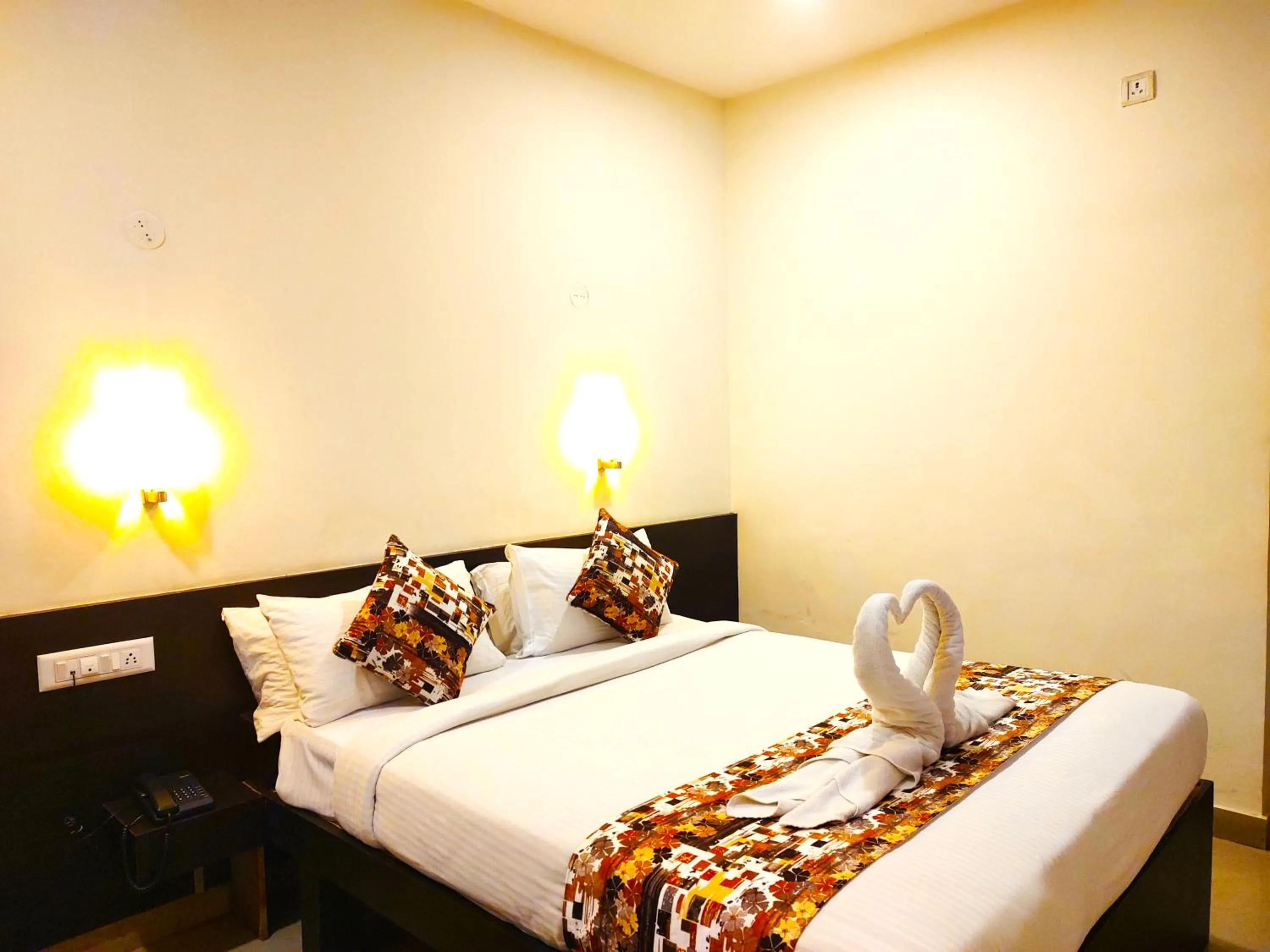 Bed in Athasri Hotel HSR Layout