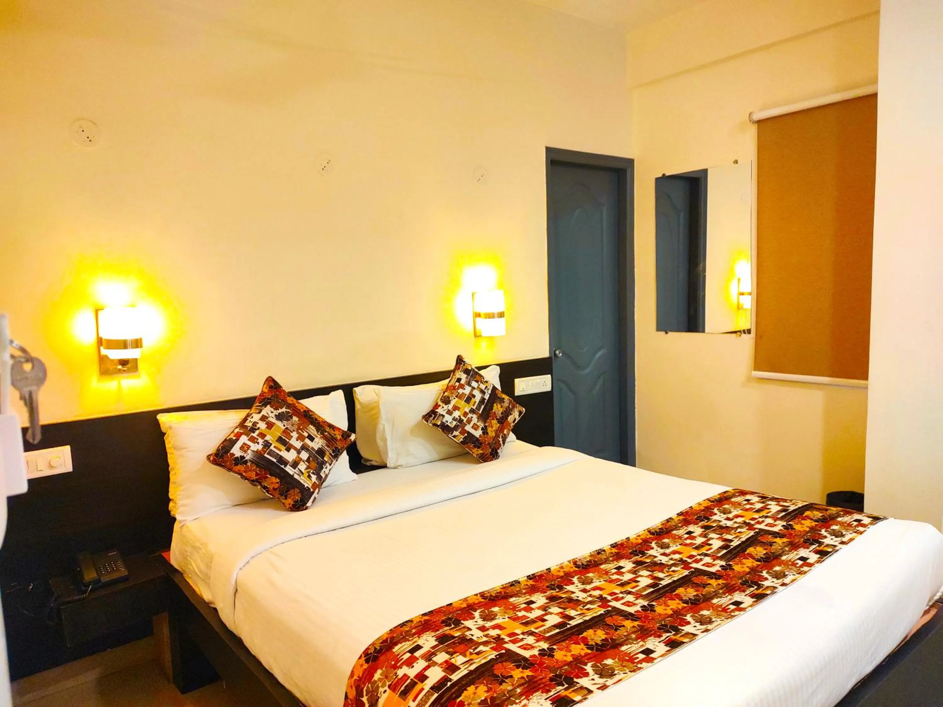 Bed in Athasri Hotel HSR Layout