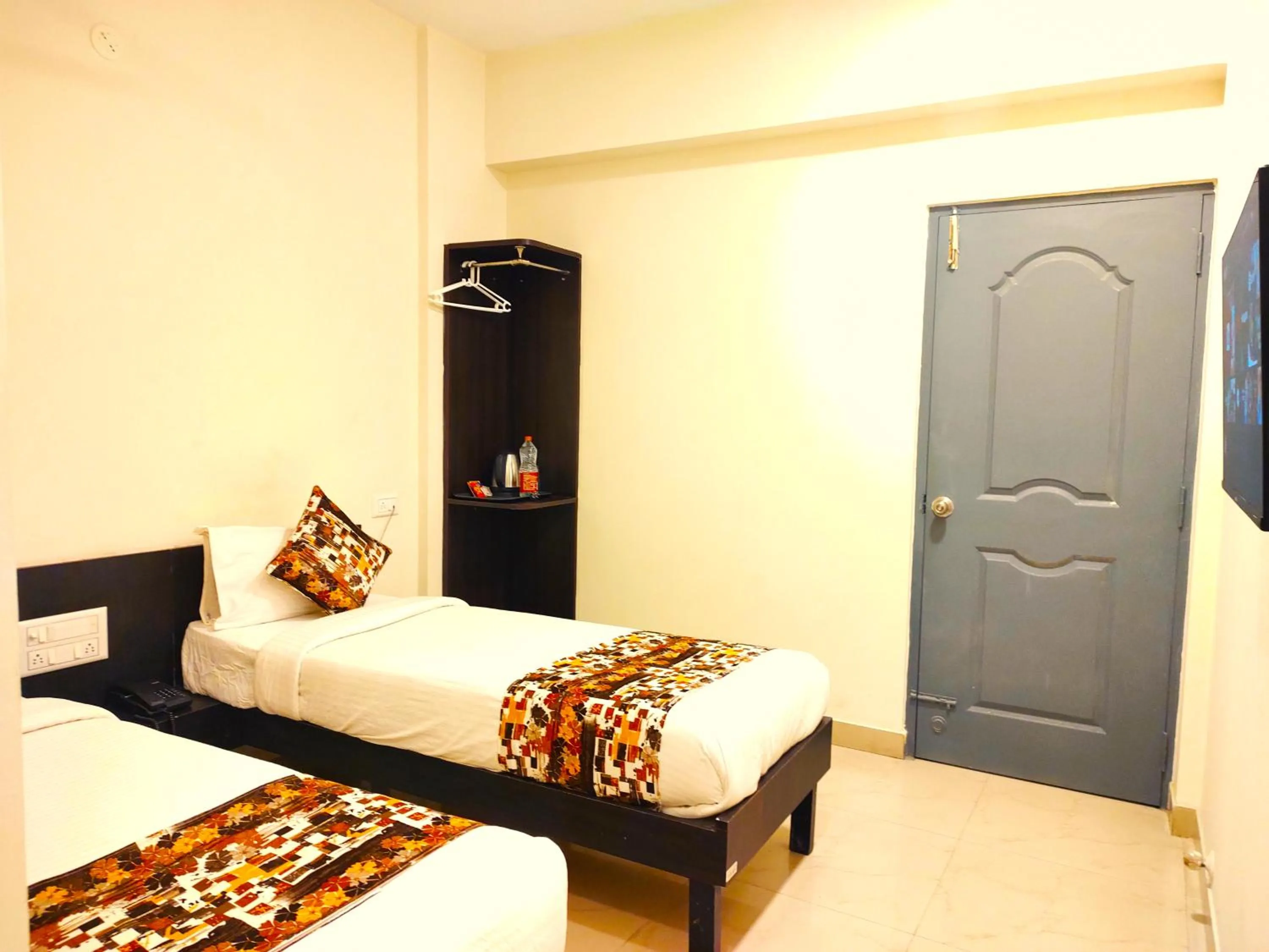 Bed in Athasri Hotel HSR Layout