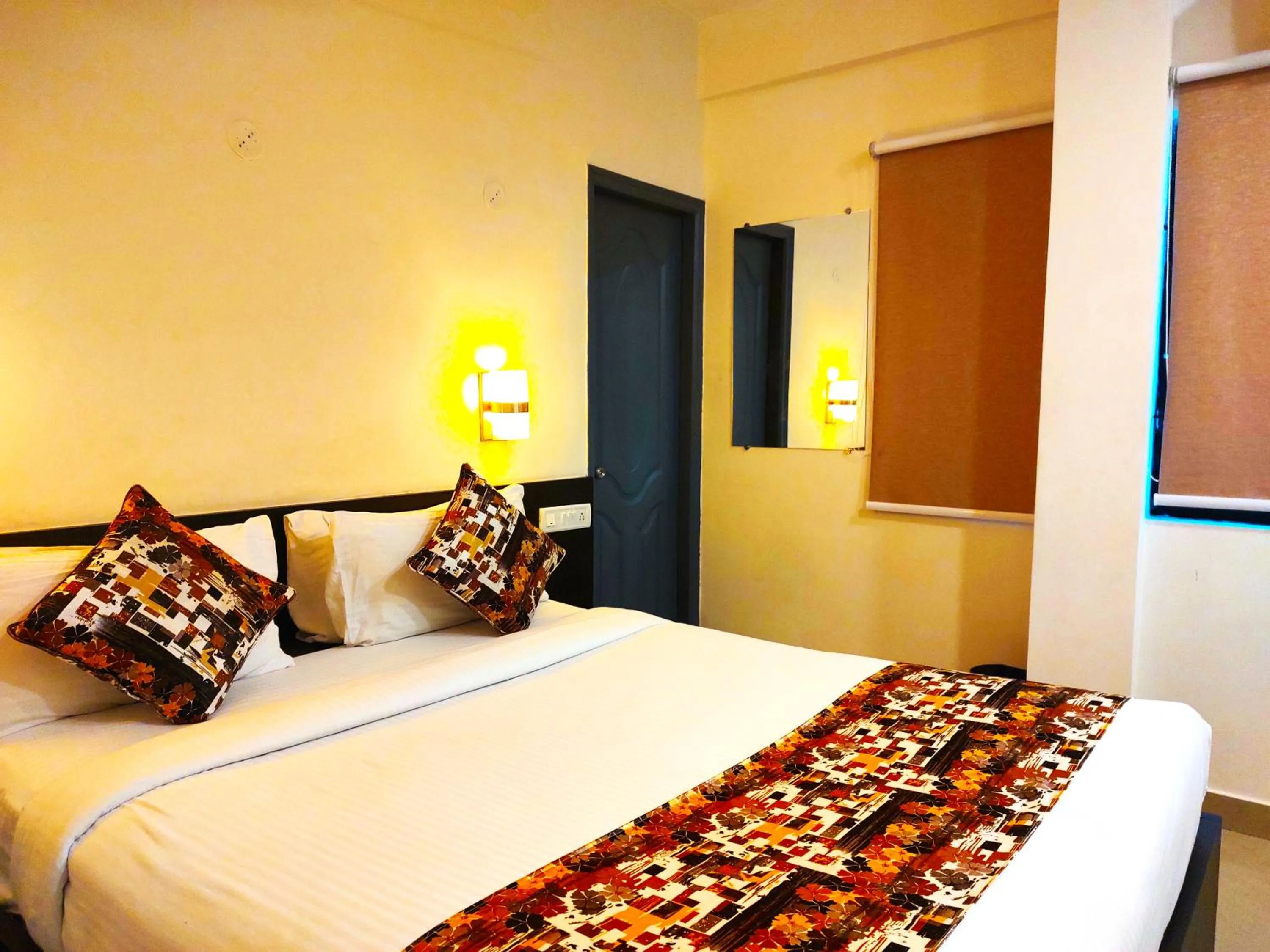 Bed in Athasri Hotel HSR Layout