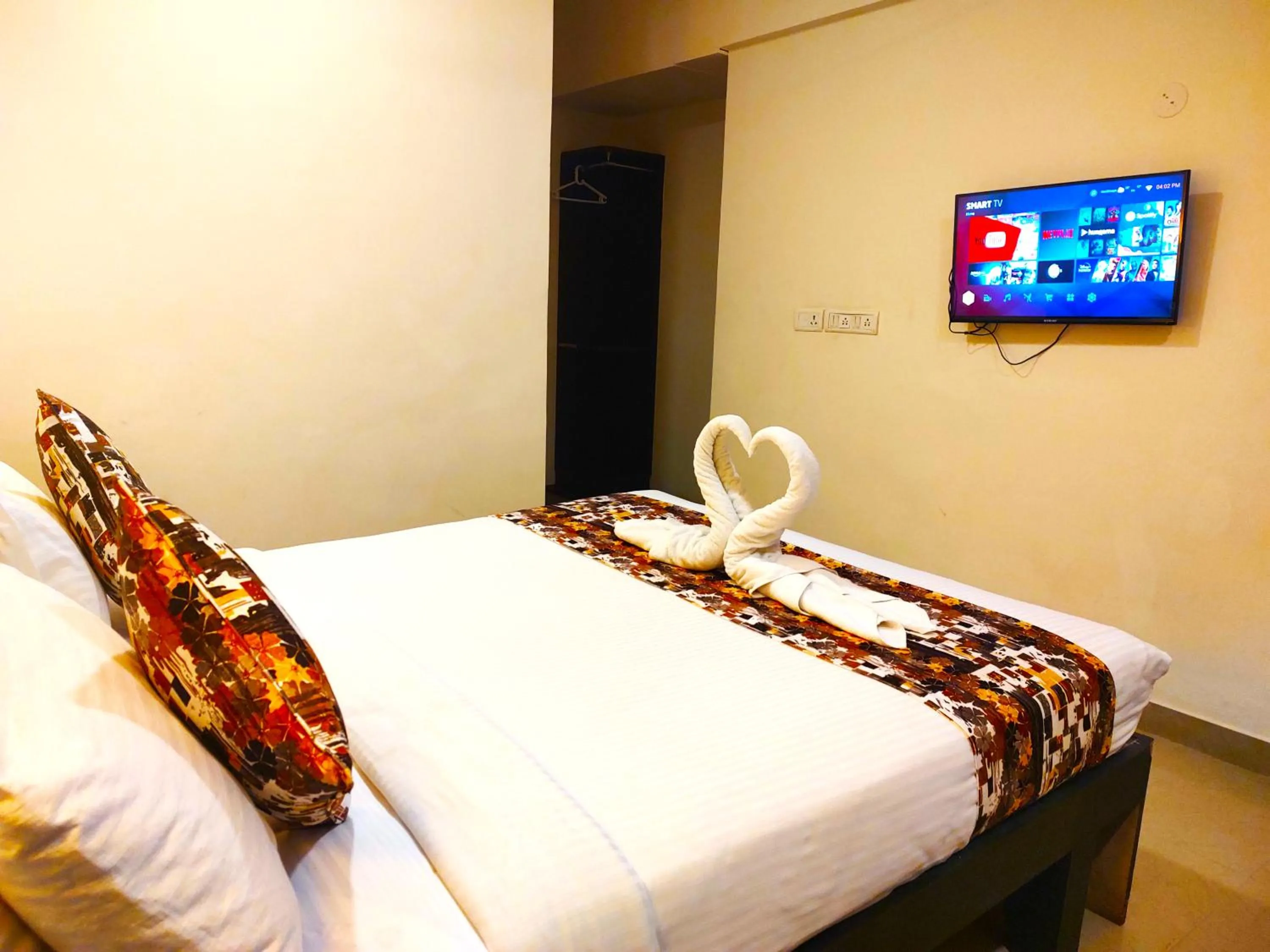 Bed in Athasri Hotel HSR Layout