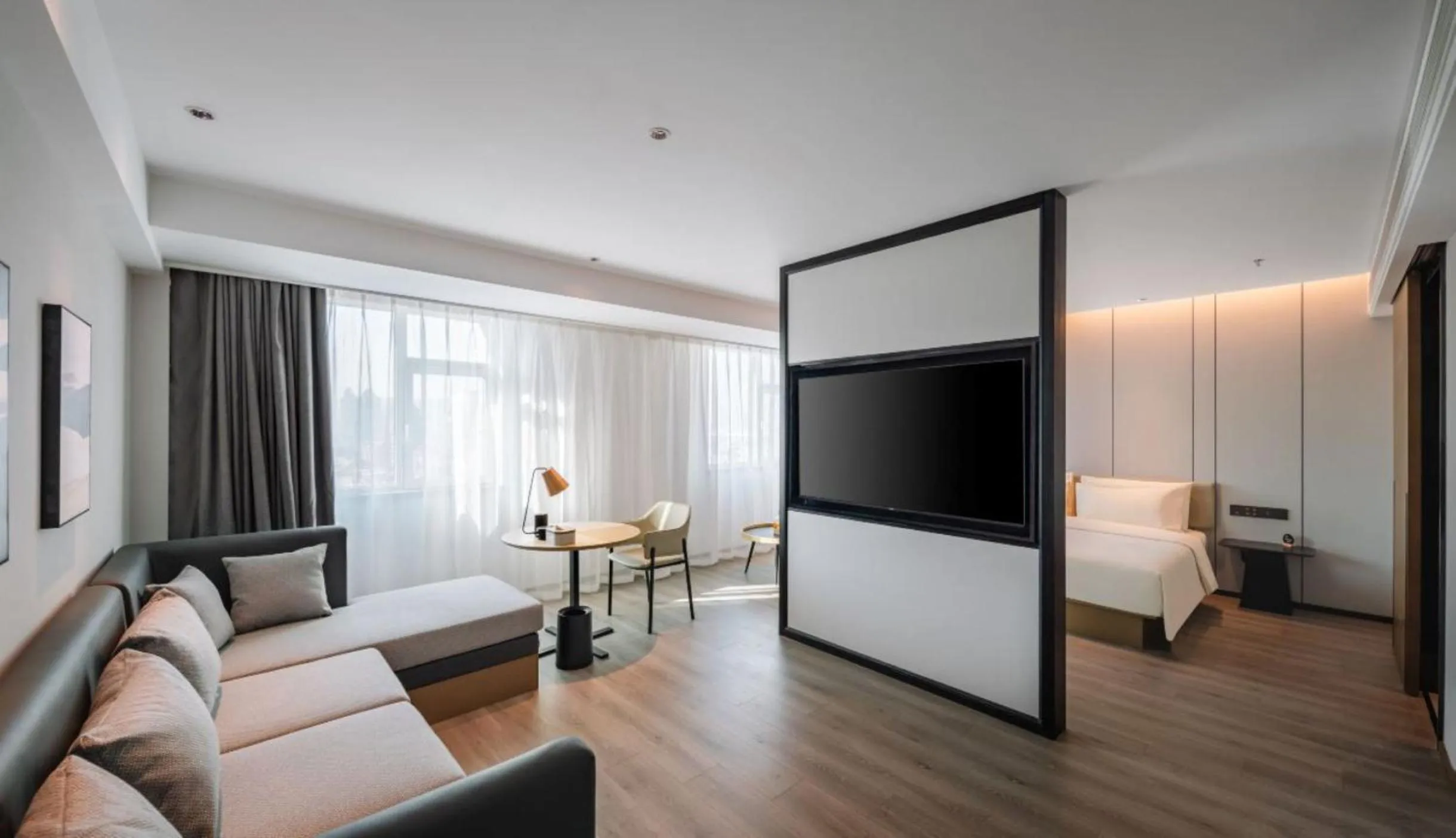 Communal lounge/ TV room, Bed in Atour Hotel Shenyang Changbai Island