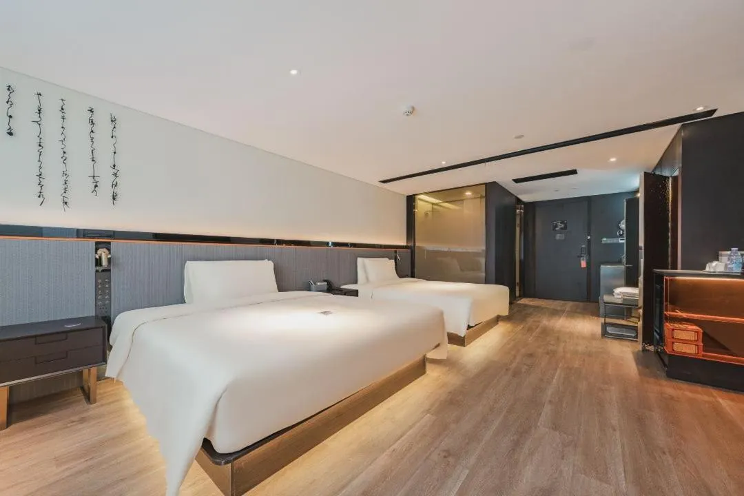 Bed in Atour S Hotel Wuxi Nanchang Street