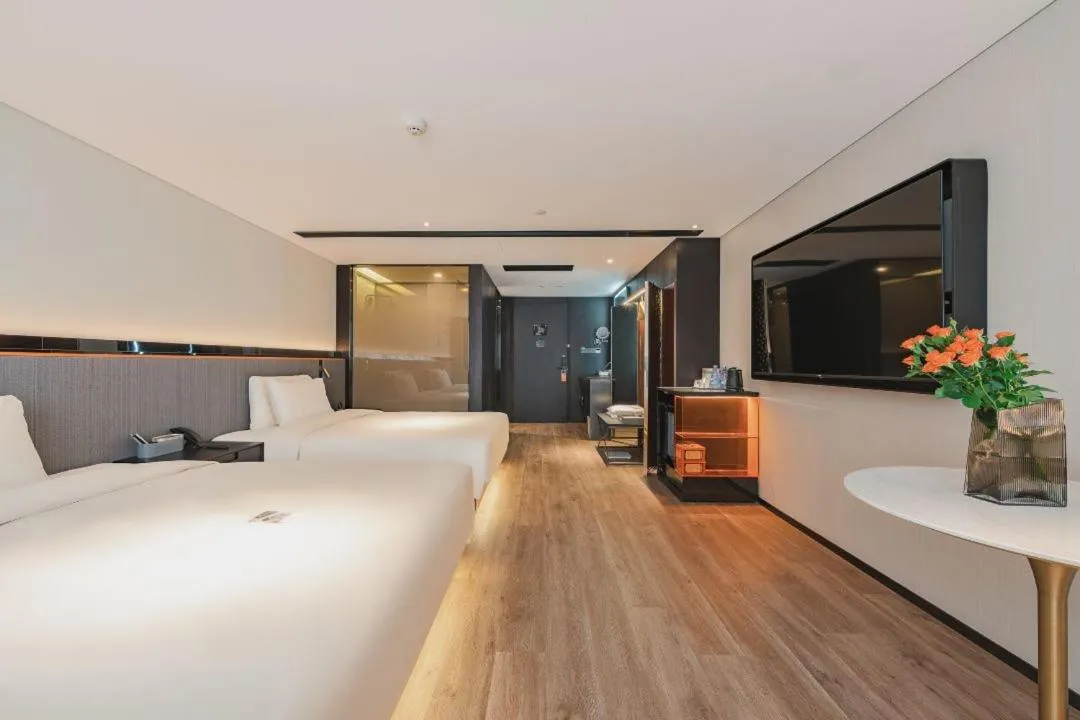 Bed in Atour S Hotel Wuxi Nanchang Street