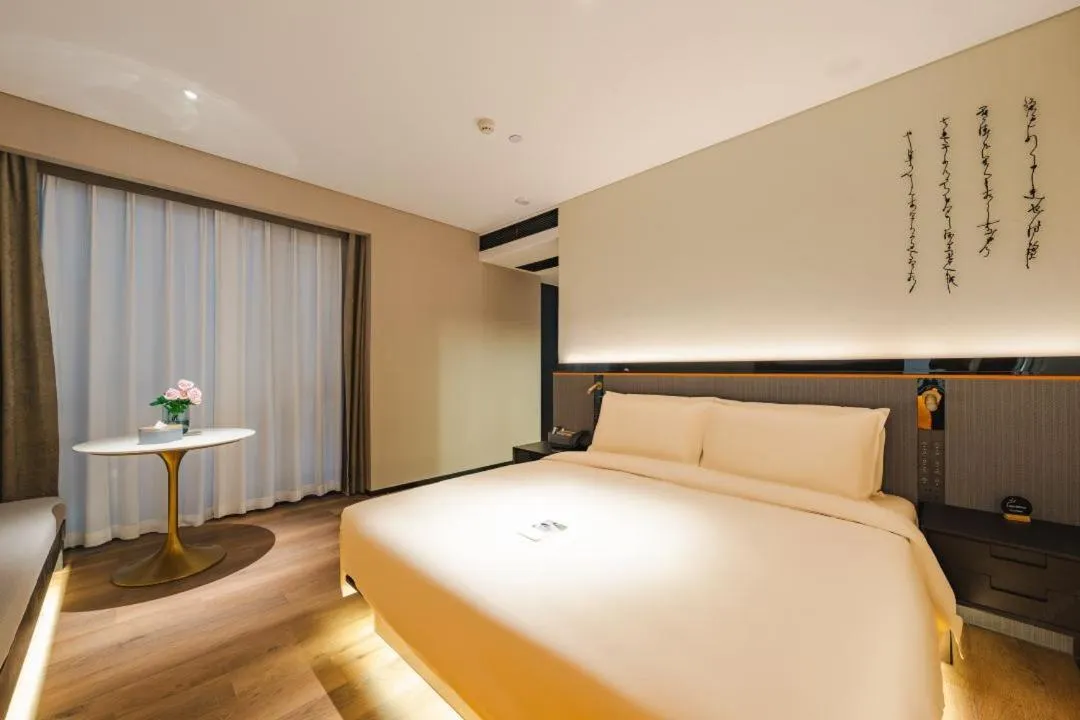 Bed in Atour S Hotel Wuxi Nanchang Street