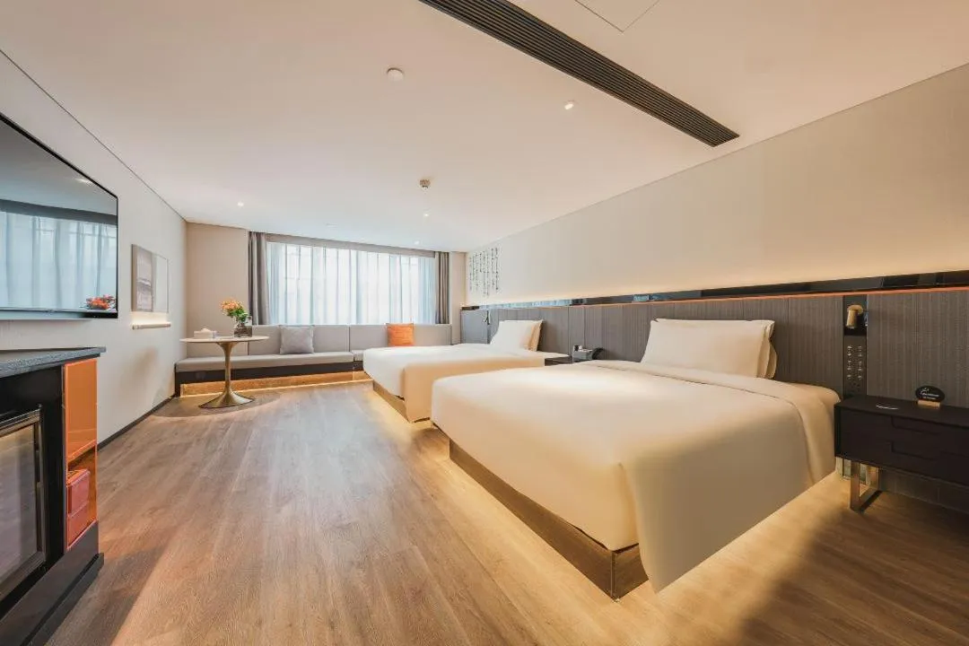 Bed in Atour S Hotel Wuxi Nanchang Street