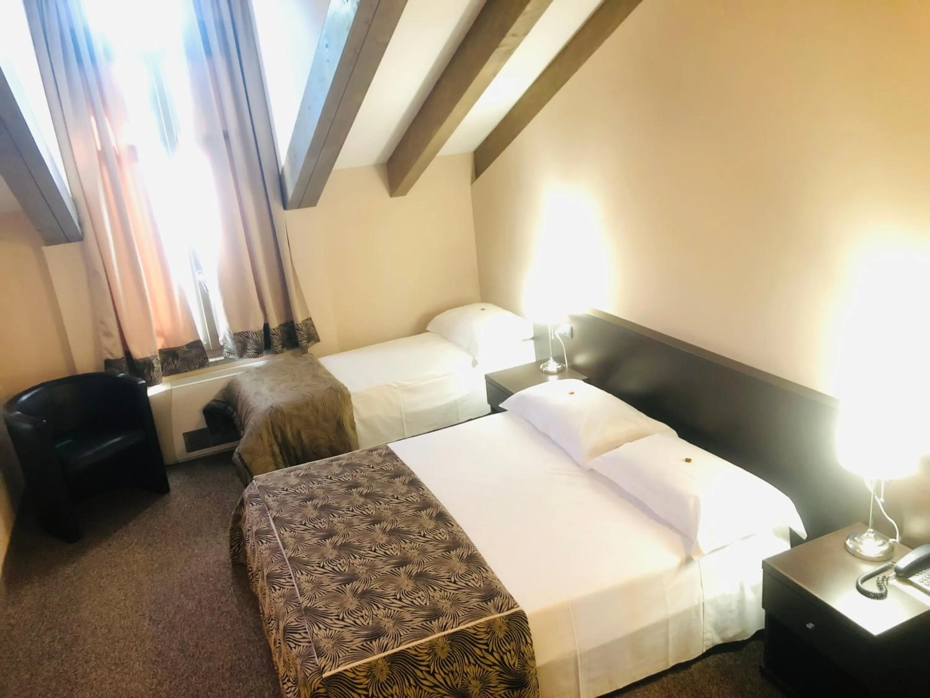 Photo of the whole room, Bed in Hotel Malpensa INN Aereoporto