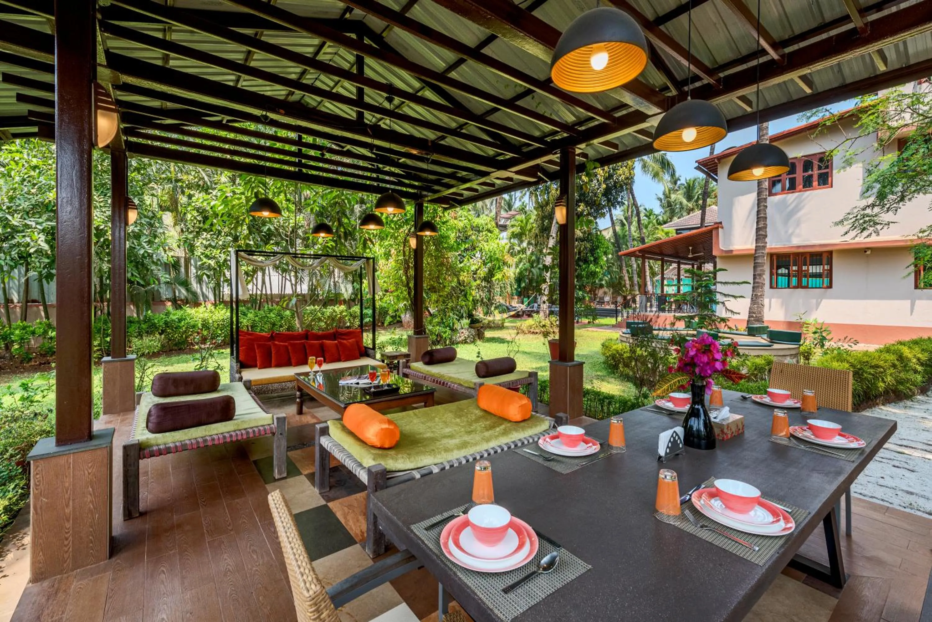 Property building in SaffronStays Casa Del Palms - 8BR luxury pool villa with gazebo, pickleball, bar & lawns near Nagaon Beach