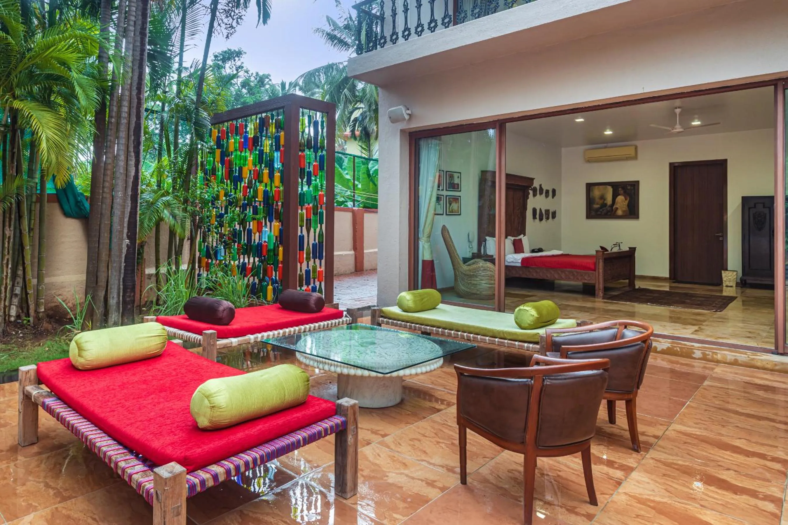 Seating area in SaffronStays Casa Del Palms - 8BR luxury pool villa with gazebo, pickleball, bar & lawns near Nagaon Beach