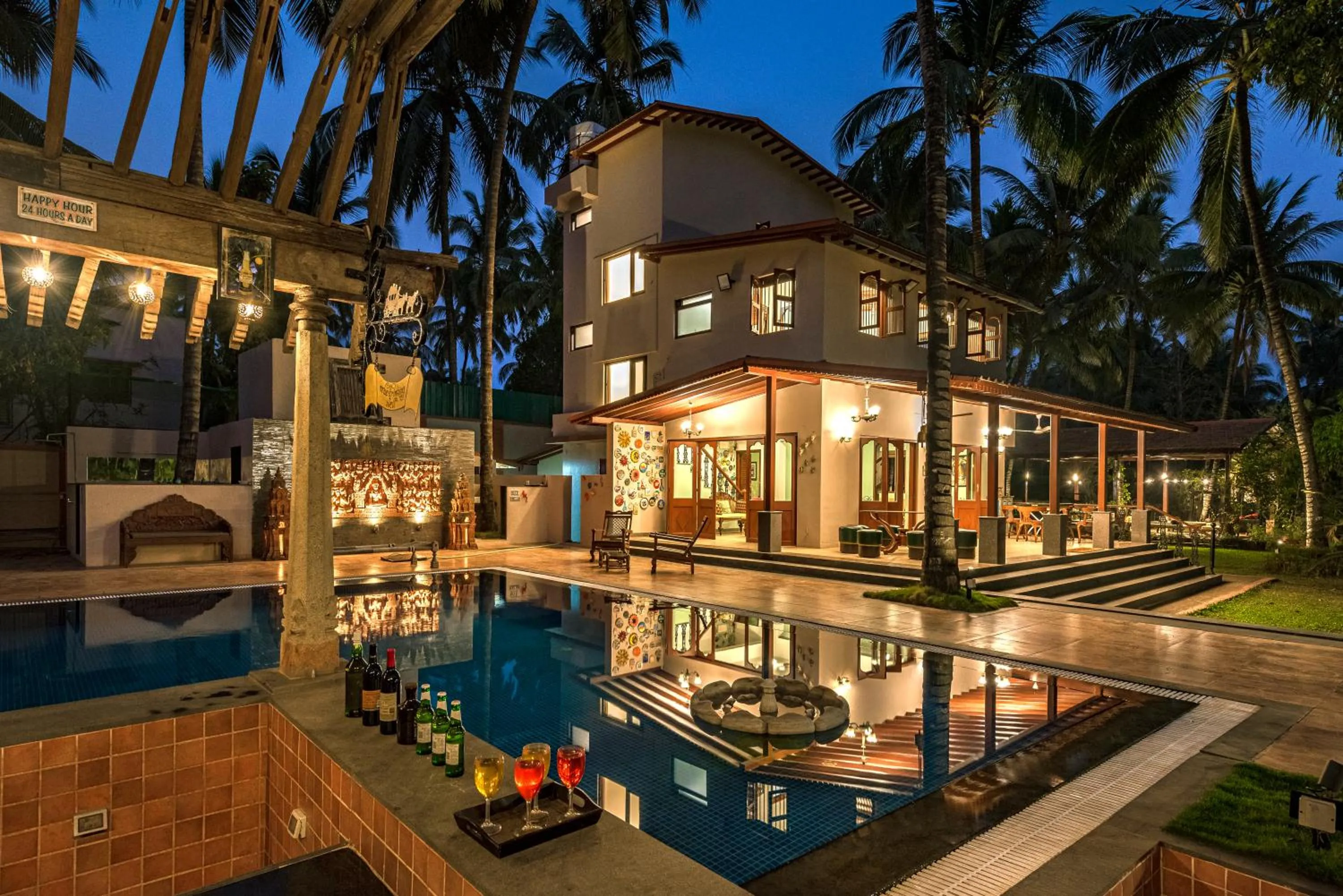 Property building in SaffronStays Casa Del Palms - 8BR luxury pool villa with gazebo, pickleball, bar & lawns near Nagaon Beach