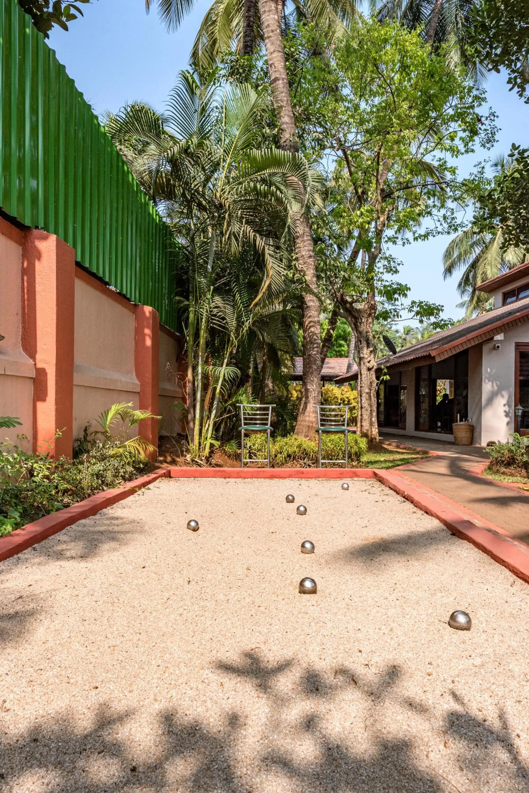Day in SaffronStays Casa Del Palms - 8BR luxury pool villa with gazebo, pickleball, bar & lawns near Nagaon Beach