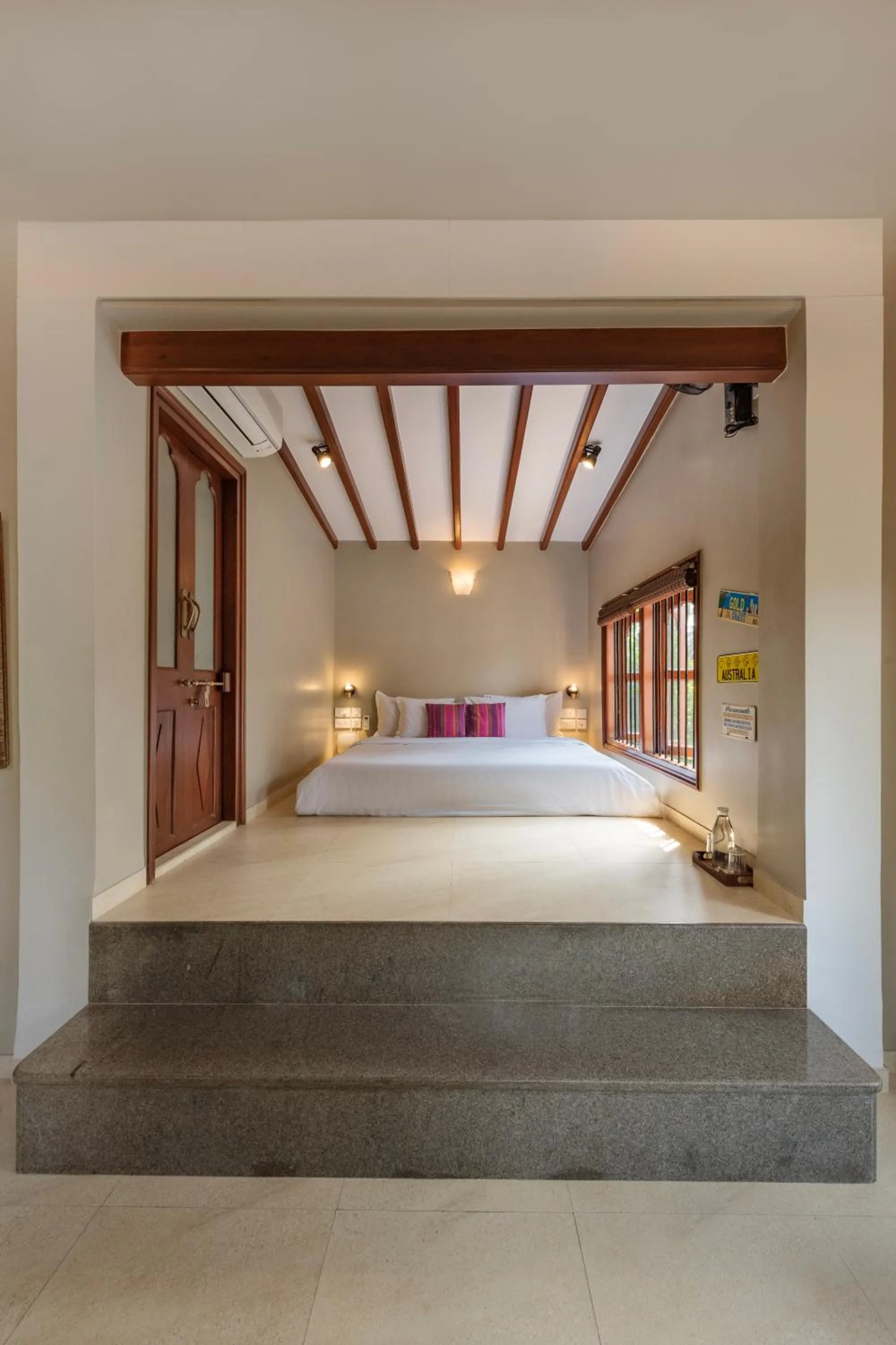 Bed in SaffronStays Casa Del Palms - 8BR luxury pool villa with gazebo, pickleball, bar & lawns near Nagaon Beach